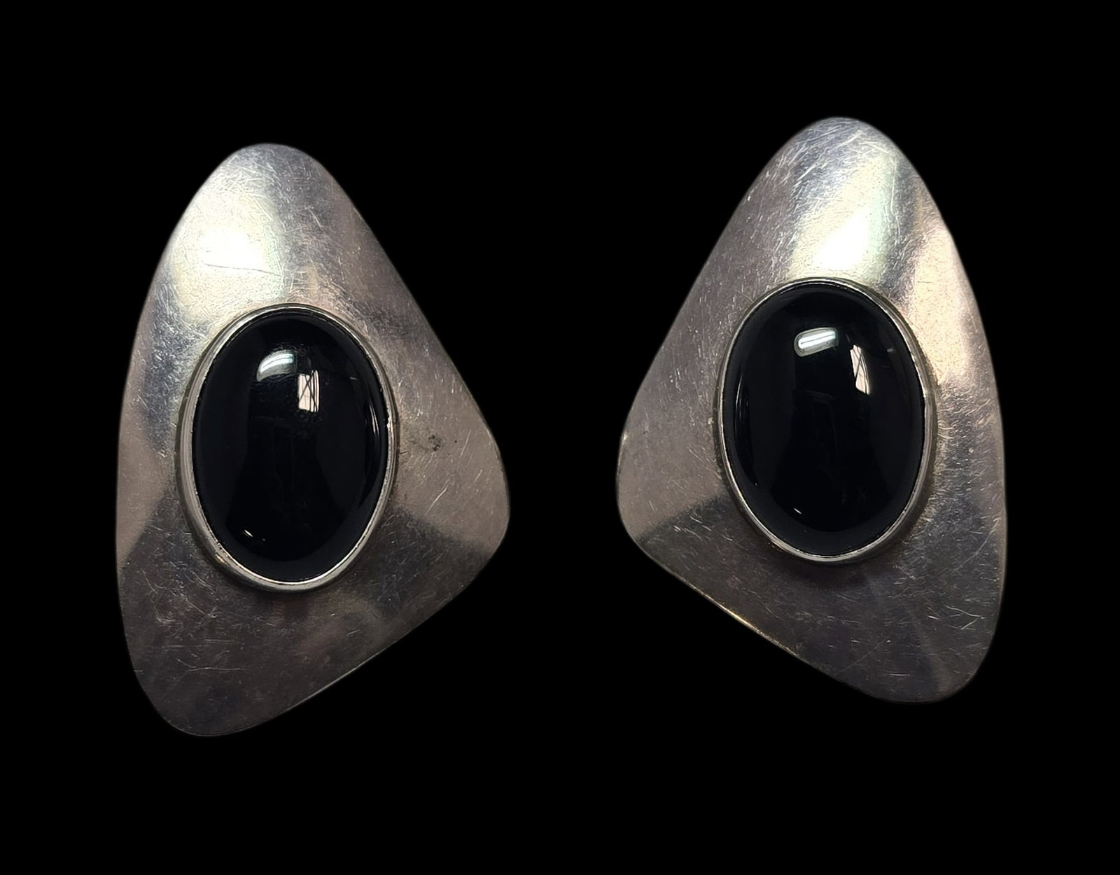 Vintage Mid-Century Sterling Silver & Black Onyx Designer Earrings: Very good vintage condition with minor patina and wear according to age. Each measures approx. 1" wide and weighs ca. 5.5 grams. Marked for Sterling Silver. and carrying an unidentified designer mark.