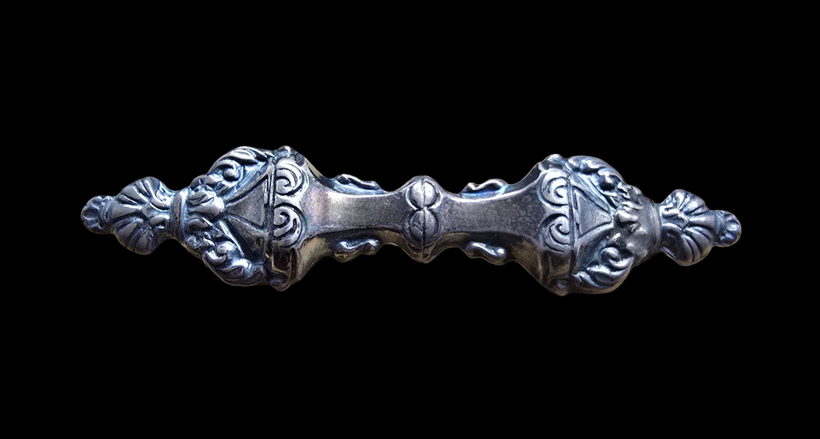Ornate Antique Sterling Silver Brooch: Very good vintage condition with minor patina according to age. Measures approx. 2 1/2" long and weighs ca. 7 grams. Tested for Sterling Silver.