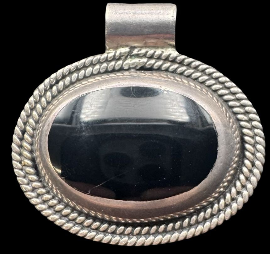 Large & Heavy Vintage Sterling Silver & Black Onyx Pendant: Very good vintage condition with minor patina according to age. Measures approx. 1 1/2" wide and 1 3/8" high and weighs ca. 18 grams. Marked for Sterling Silver..