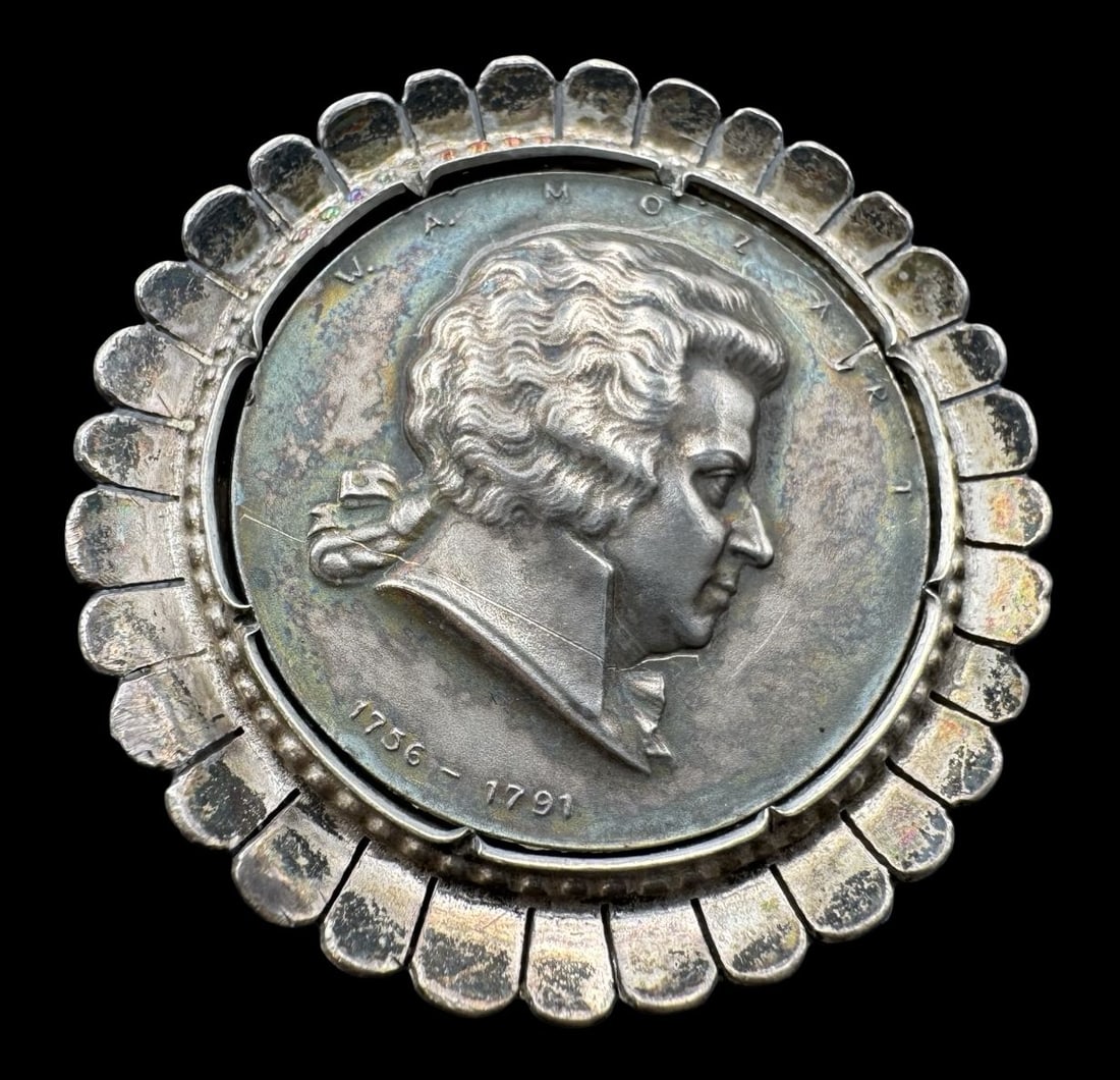 Antique Austrian European 835 Silver Mozart Pendant Brooch: Very good antique condition with minor patina according to age. Measures approx. 1 3/8" in diameter and weighs ca. 14 grams. Marked for 835 Silver.