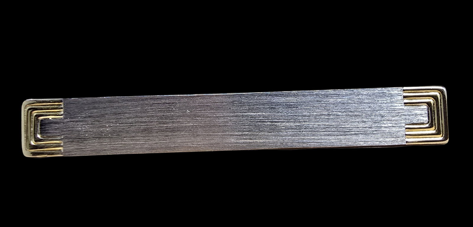 Ornate Vintage Sterling Silver Tie Clip: Very good vintage condition with minor patina according to age. Measures approx. 2" wide and weighs ca. 9 grams. Marked for Sterling Silver.