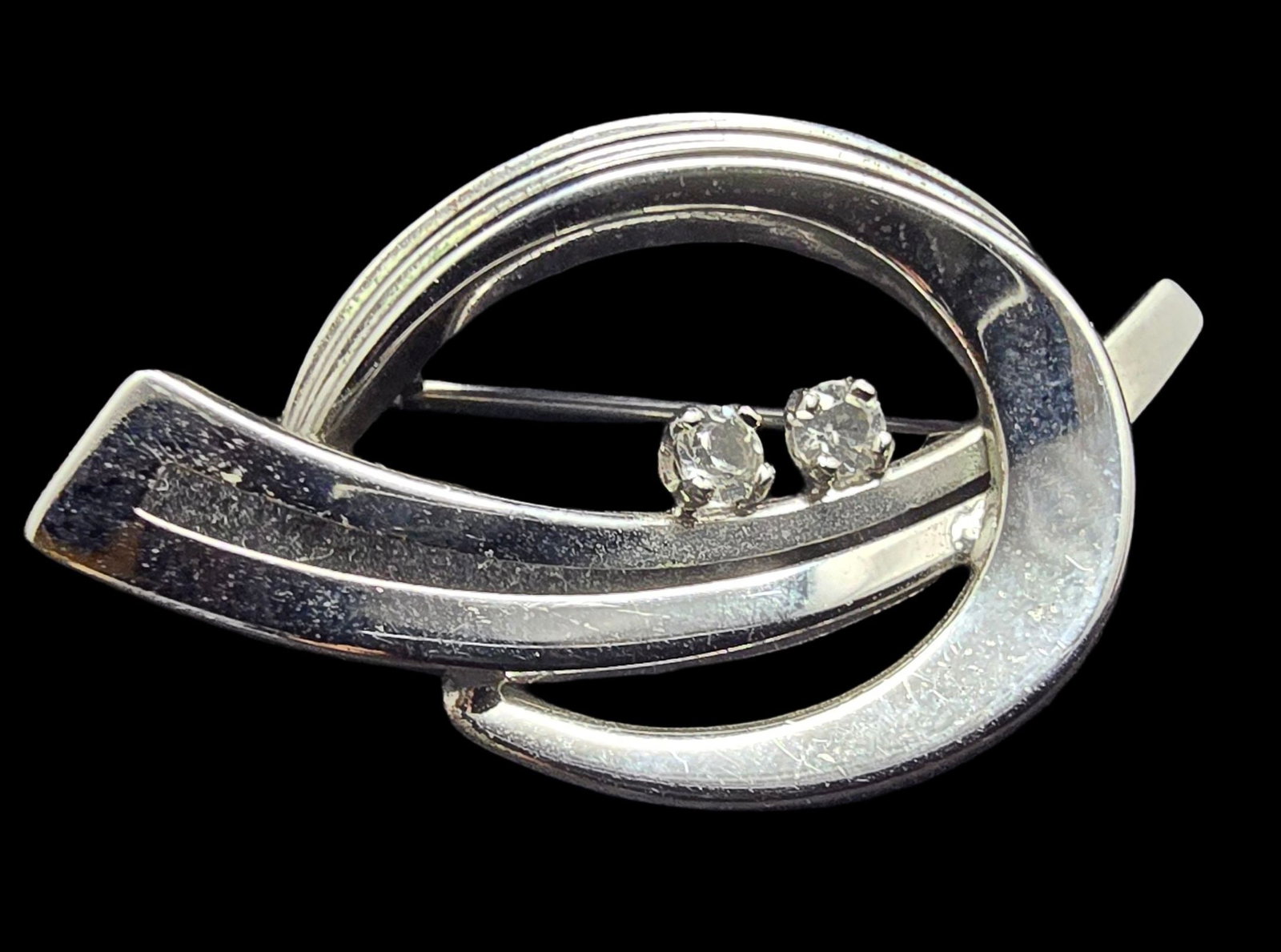 Stylish Vintage Mid-Century TEKA Germany Sterling Silver & Clear Rhinstone Pin Brooch: Very good vintage condition with minor patina according to age. Measures approx. 1 1/2" wide and weighs ca. 2.5 grams. Marked for Sterling Silver and TEKA.