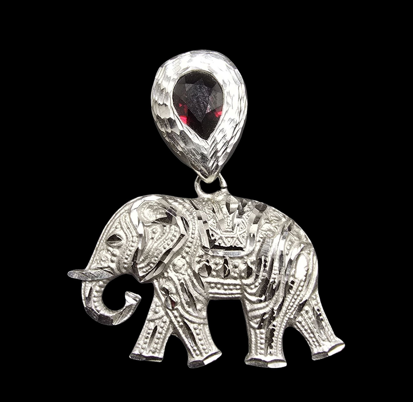 Stunning Vintage Sterling Silver & Red GemstoneElephant Pendant Charm: Very good vintage condition with minor patina according to age. Measures approx. 1 1/2" long and 1" wide and weighs ca. 6 grams. Tested for Sterling Silver.