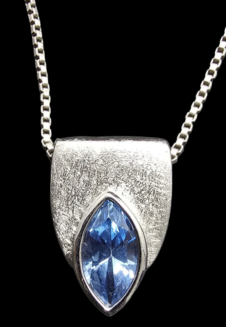 Gorgeous Vintage Sterling Silver & Blue Gemstone Pendant Necklace: Very good vintage condition with minor patina according to age. Pendant measures approx. 1/2" long and 1/2" wide and total weight is ca. 8 grams. The necklace is 18" long. Marked for Sterling Silver.