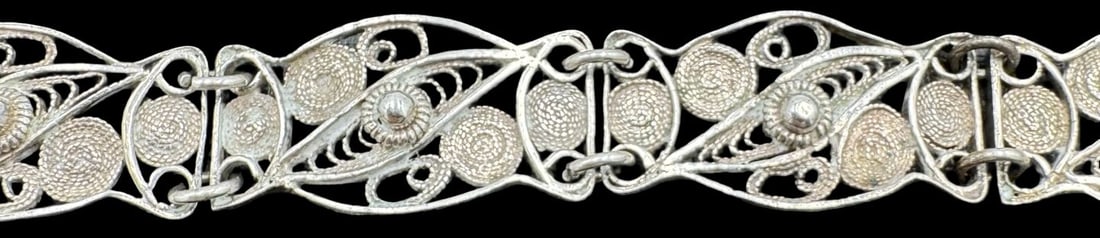 Stylish Handmade Vintage Sterling Silver Filigree Bracelet: Very good vintage condition with minor patina according to age. Measures approx. 8 1/2" long x 1/2" wide and weighs ca. 9.2 grams. Marked for Sterling Silver..
