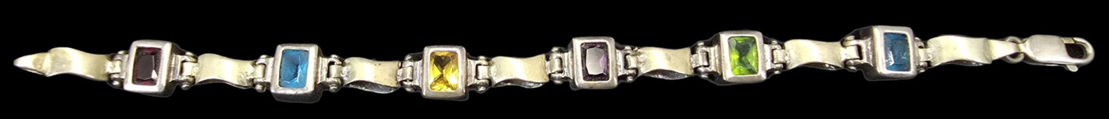 Stylish Vintage Sterling Silver Multi-Color Gemstone Bracelet: Very good vintage condition with minor patina and wear according to age. Measures approx. 7 1/2" long and weighs ca. 16..5 grams. Marked.