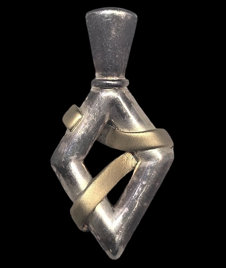 Vintage Partially Gilt Sterling Silver Pendant: Very good vintage condition with minor patina and wear according to age. Measures approx. 1 1/2" high and weighs ca. 6.5 grams. Marked for Sterling Silver..