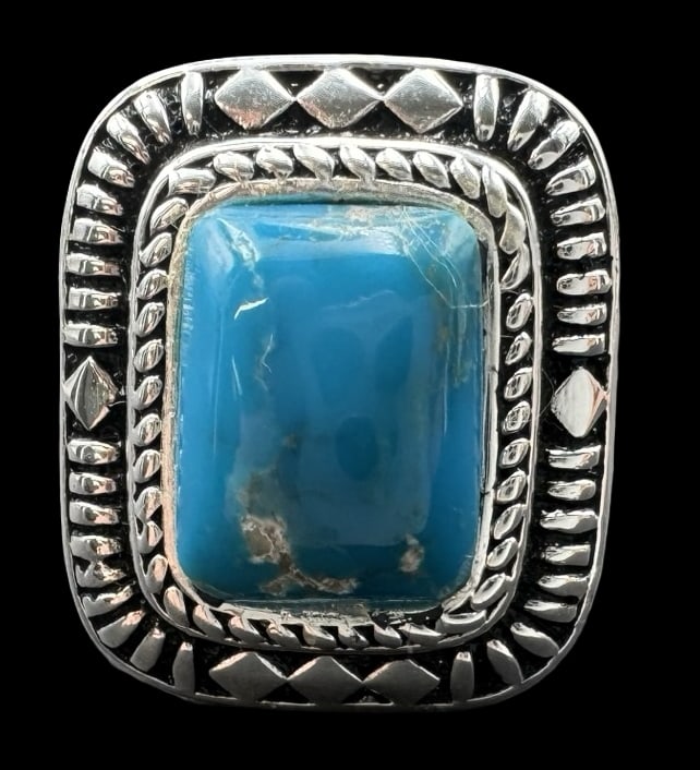 Ornate Vintage Sterling Silver & Blue Gemstone Ring: Very good vintage condition with minor patina according to age. Measures approx. 3/4" long x 5/8" wide and weighs ca. 8.2 grams. The ring is a size 7 1/2. Marked for Sterling Silver..