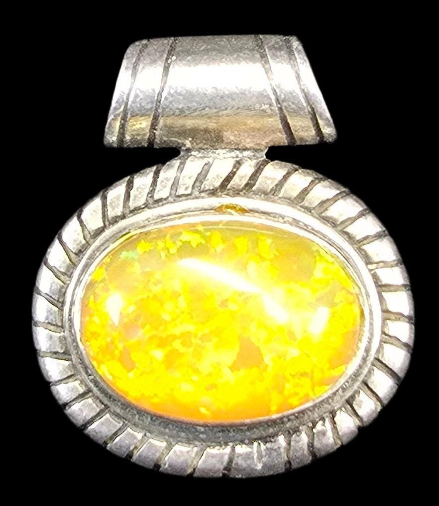 Vintage Sterling Silver & Yellow Gemstone Pendant: Very good vintage condition with minor patina and wear according to age. Measures approx. 1" high and 1" wide and weighs ca. 5 grams. Marked.