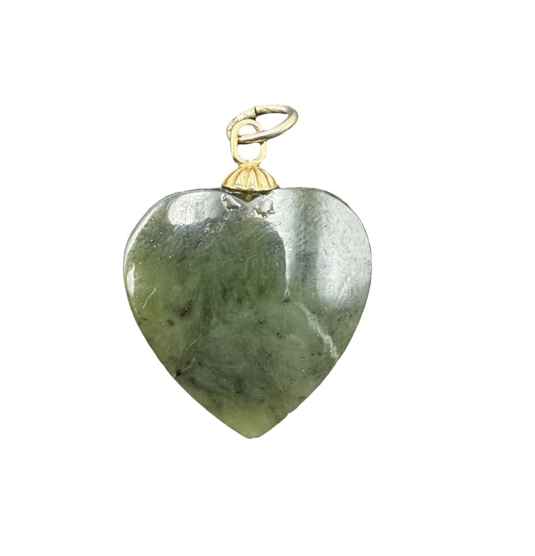 Vintage Nephrite Jade Heart Pendant: Very good antique condition with minor patina according to age. Measures approx. 1" long and 3/4" wide and weighs ca. 2.24 grams.
