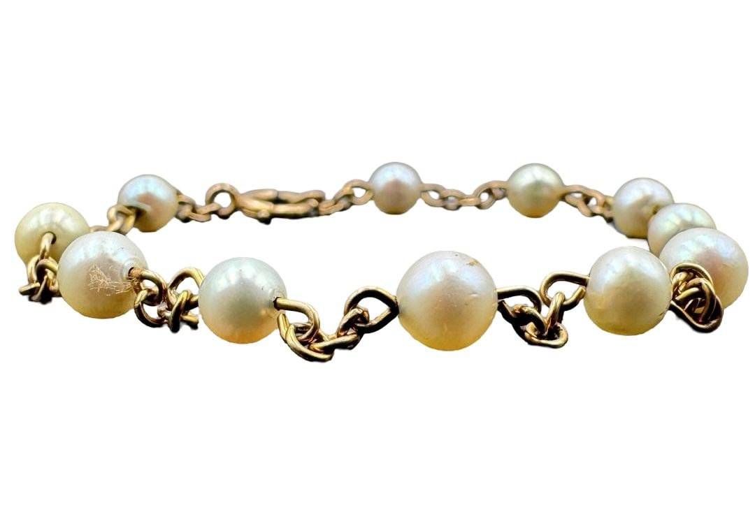 Gorgeous Antique 10K Gold Pearl Bracelet: Very good antique condition with minor patina according to age. Measures approx. 3.5" long and weighs ca. 3.99 grams. Tested for 10K Gold.