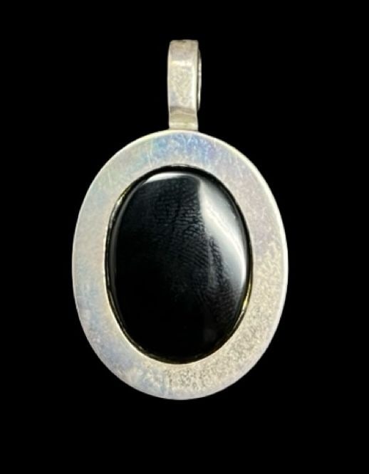 Stylish Vintage Mid-Century Modern Sterling Silver & Black Onyx Pendant: Very good vintage condition with minor patina according to age. Measures approx. 1 1/8" long and 3/4" wide and weighs ca. 5.9 grams. Marked for Sterling Silver.
