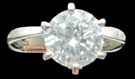 Vintage Sterling Silver & Clear Rhinestone Engagement Ring: Very good vintage condition with minor patina according to age. Measures approx. 1/4" long and 1/4" wide and weighs ca. 3 grams. The ring is a size 7 1/2. Marked for Sterling Silver
