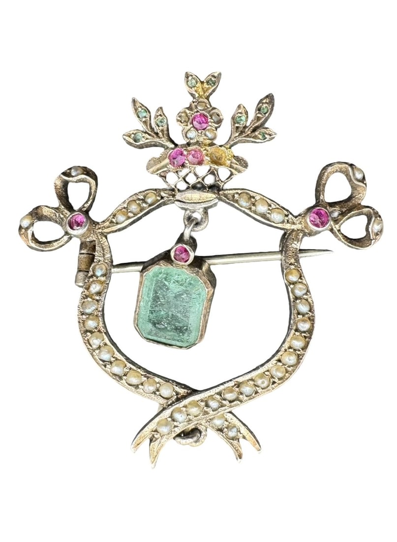 Magnificent Antique European Sterling Silver, Seed Pearl, Ruby & Blue Gemstone Openwork Bow Brooch: Very good antique condition with wear and patina according to age. Measures approx. 1.5" long x 1.25" wide and weighs ca. 6.09 grams. Tested for Sterling Silver.