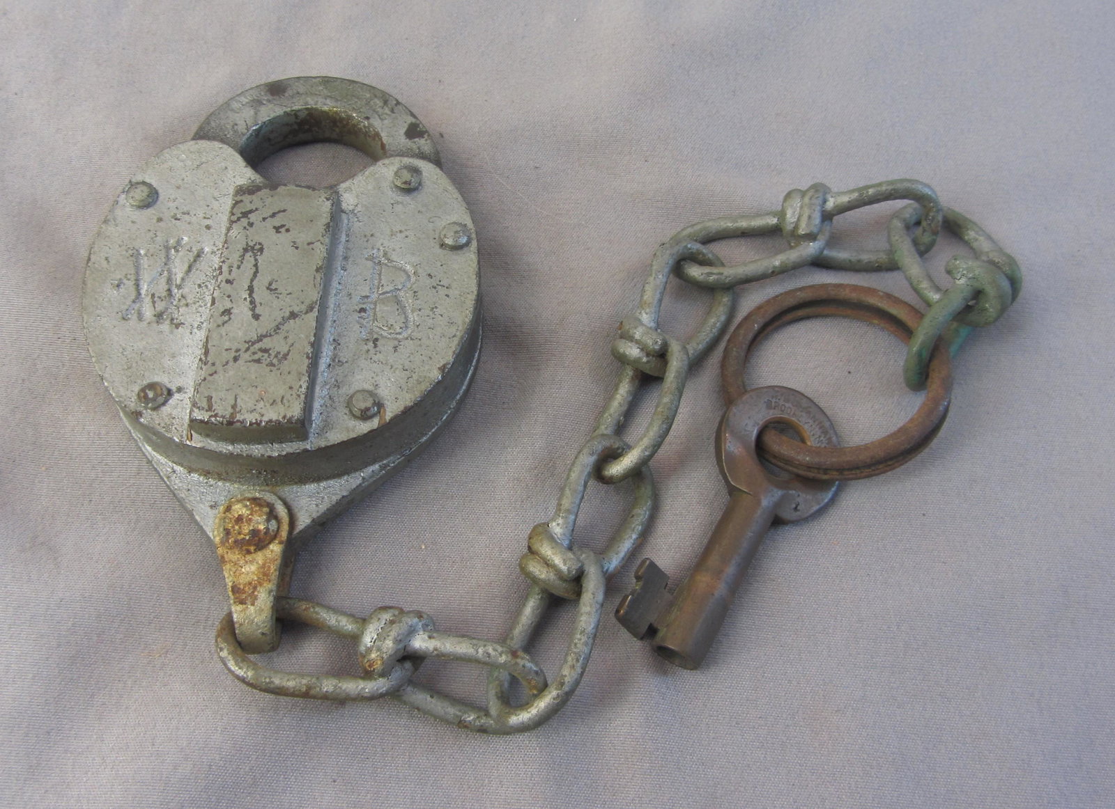 W Bohannan heart shaped lock: W Bohannan New York heart shaped lock working with key and chain solid brass construction. ORIG. Stamped Bohannon Key