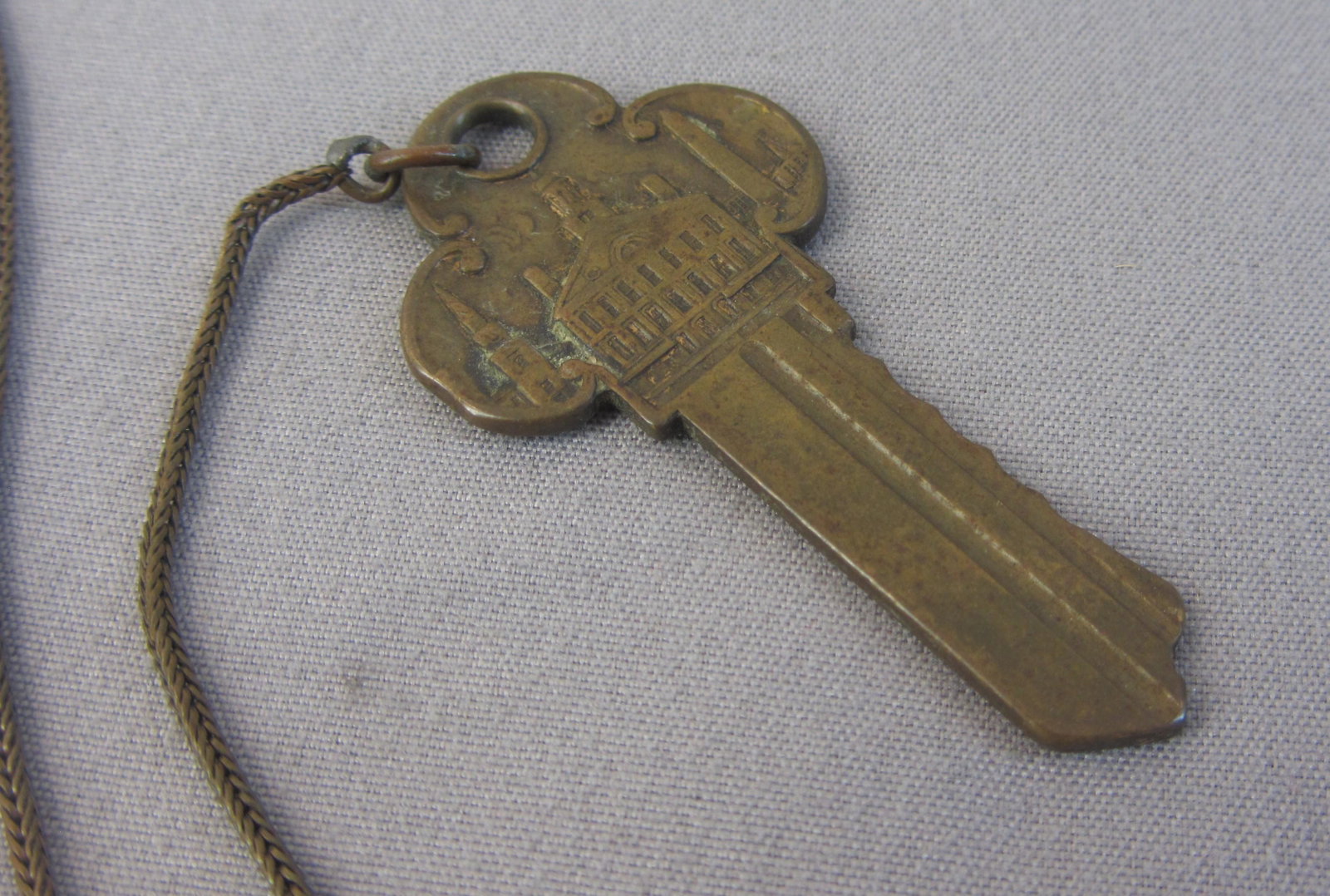 City of Boston Embossed Brass Key: Nice solid brass souvenir key embossed with the slogan city of Boston and image of State House on one side and Faneuil Hall on the other side with brass chain