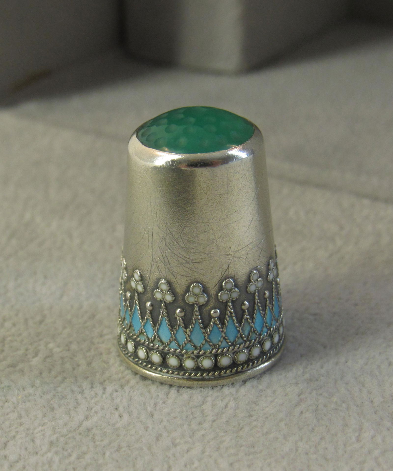 Sterling silver thimble with green top. (1 of 8)