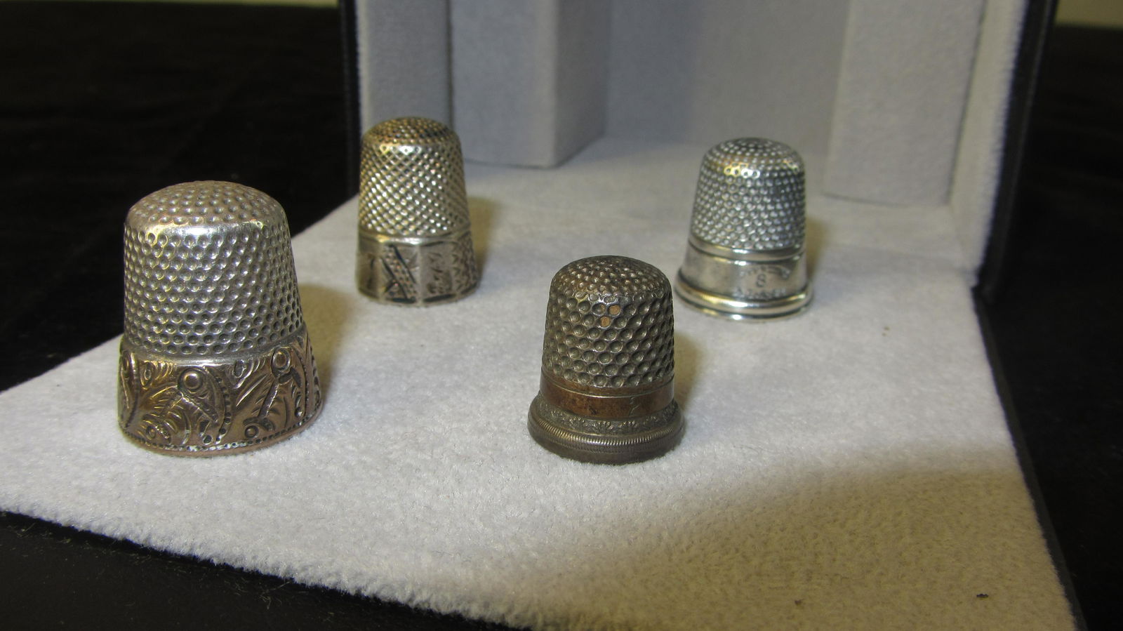 Lot of four (4) Sterling Silver thimbles with possible gold band (1 of 2)