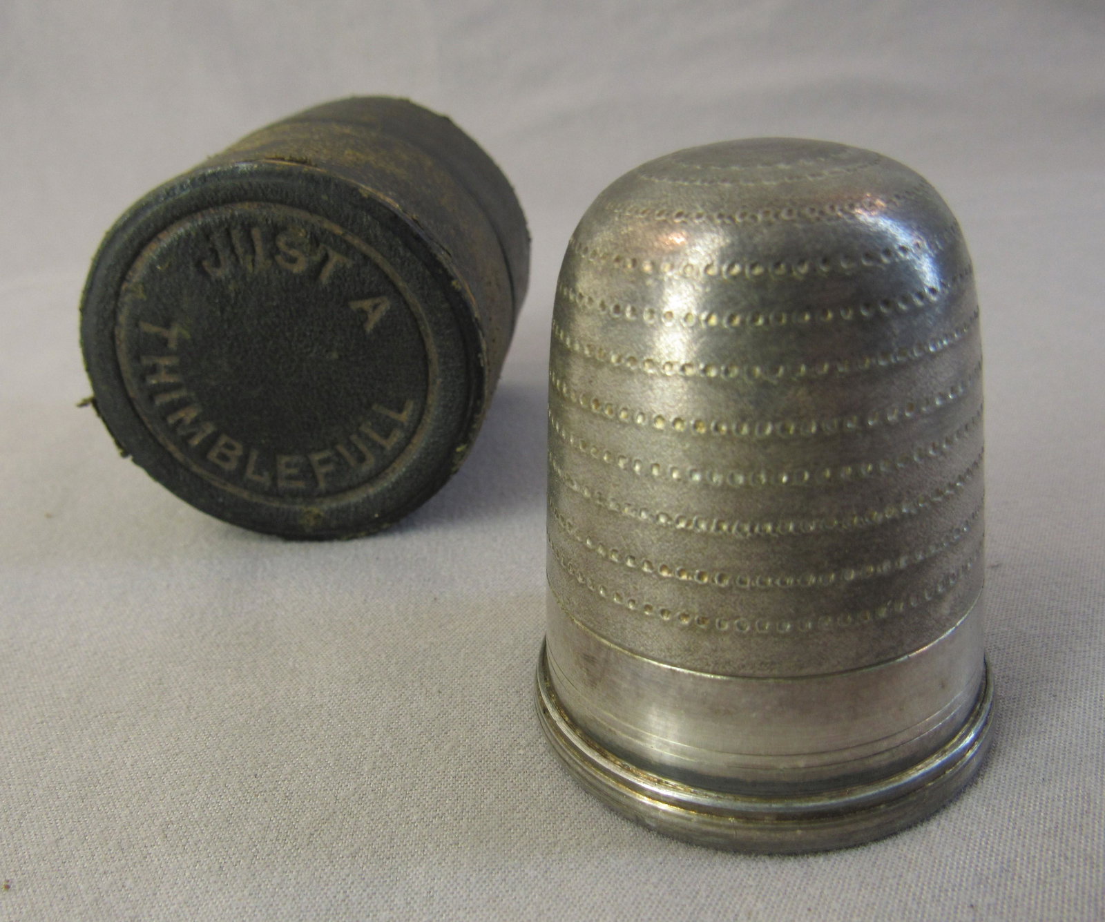 Novelty shot glass . "Just a thimble full " with case.: Novelty shot glass . Just a thimble full metal cup with case
