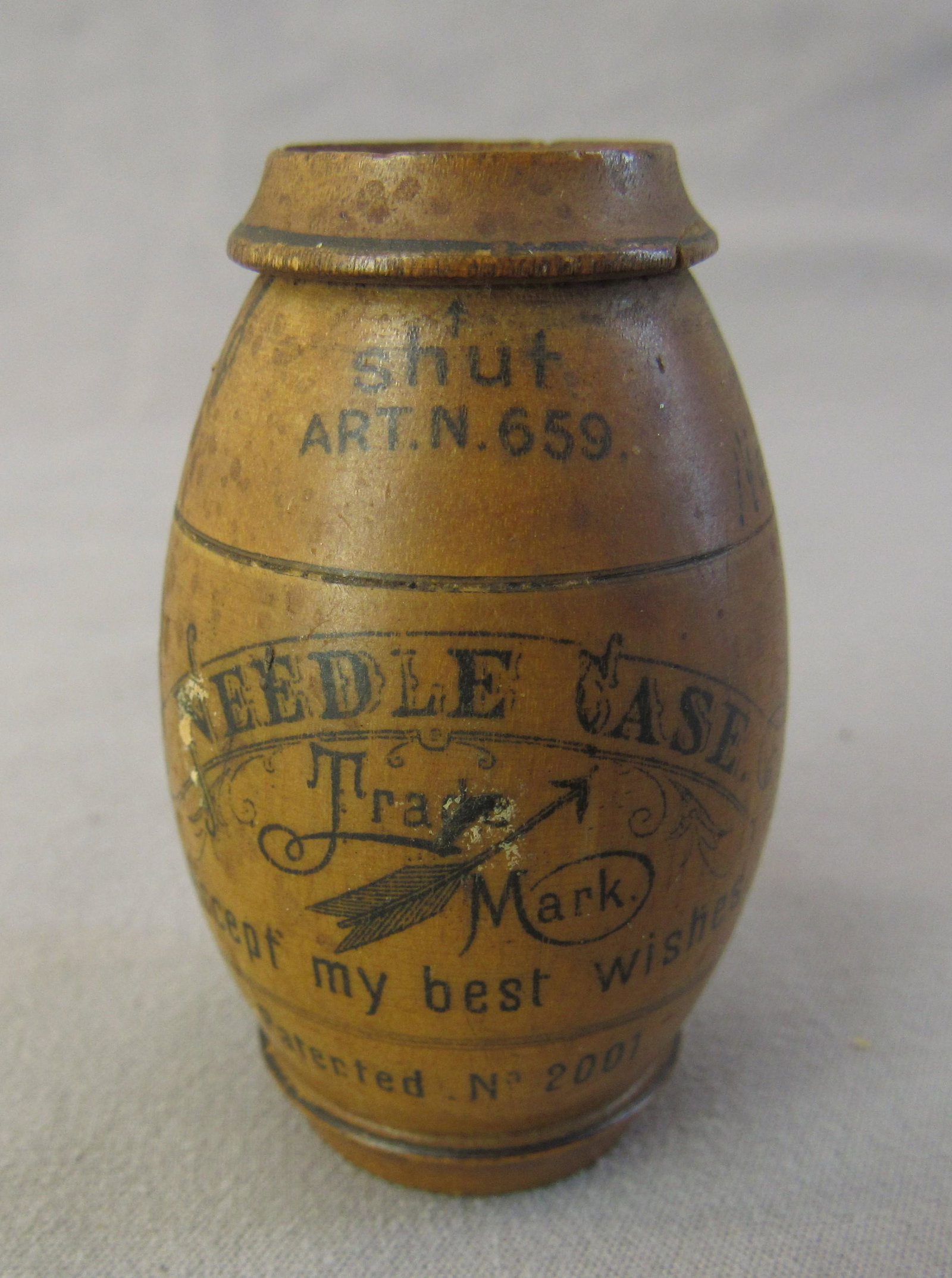 Wooden needle case. German. Patented: This is a great needle case from Germany with its German patent number of 2001 this piece was a souvenir from north Woodstock NH which is printed around the upper stripe below the numbers added after 