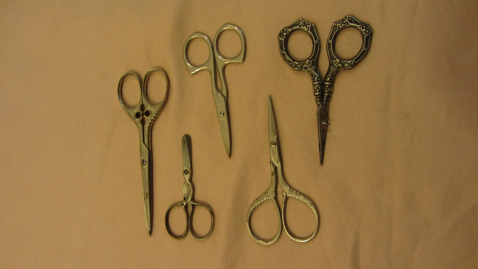 Shop lot of five scissors . Some with sterling silver handles: Shop lot of five scissors . Some with sterling silver handles. Gold Slipper-NY Advertising