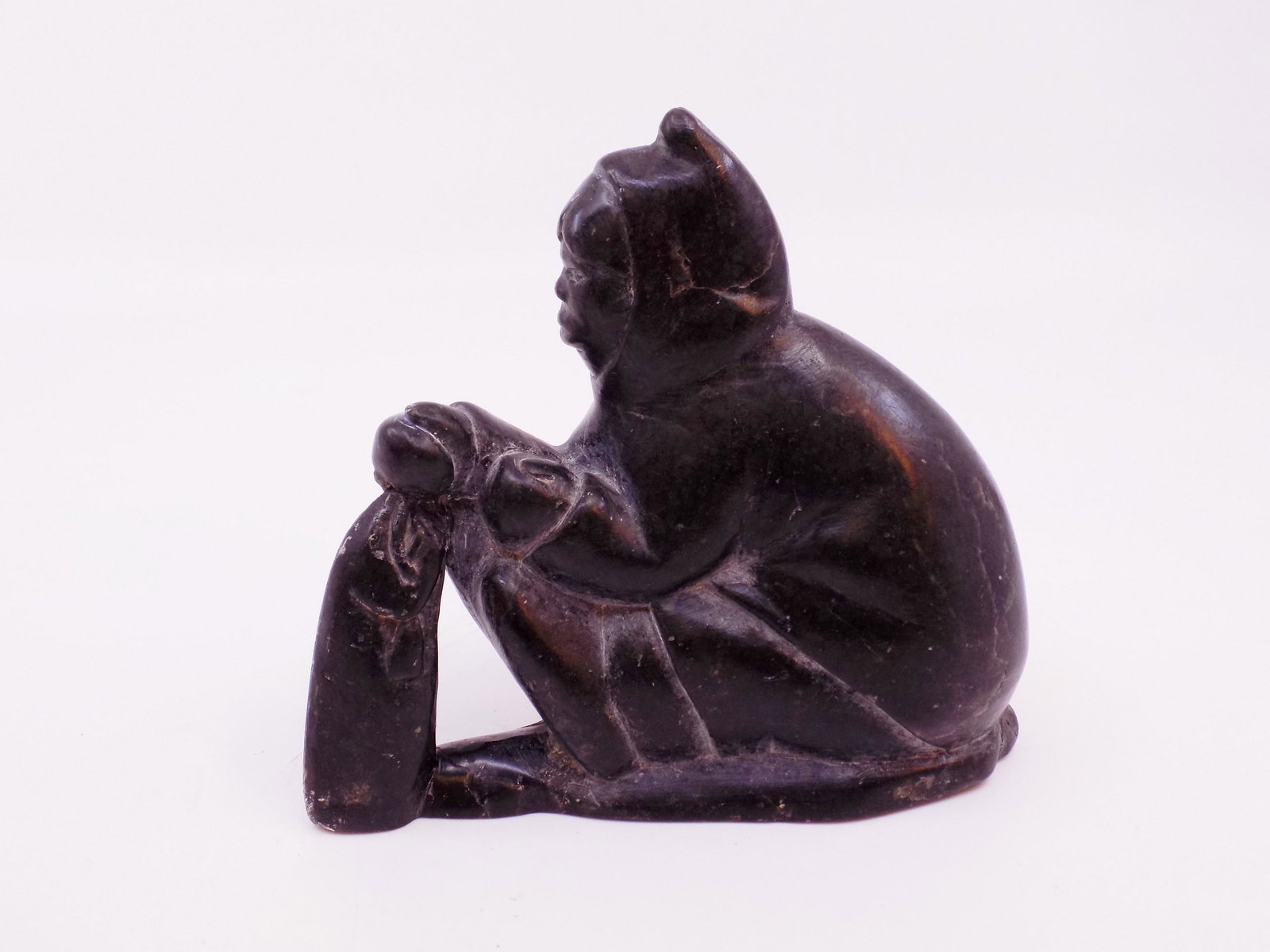Inuit Fisherman Carved By Joanassie Oomayoualook: Inuit Fisherman Carved By Joanassie Oomayoualook, Carved Black Stone, Artist born in 1934 in Northern Quebec, From 50s or 60s. - Measurement: 5 1/4" L x 4 3/4" W Weight: 1 Lb. 9.5 OZ.