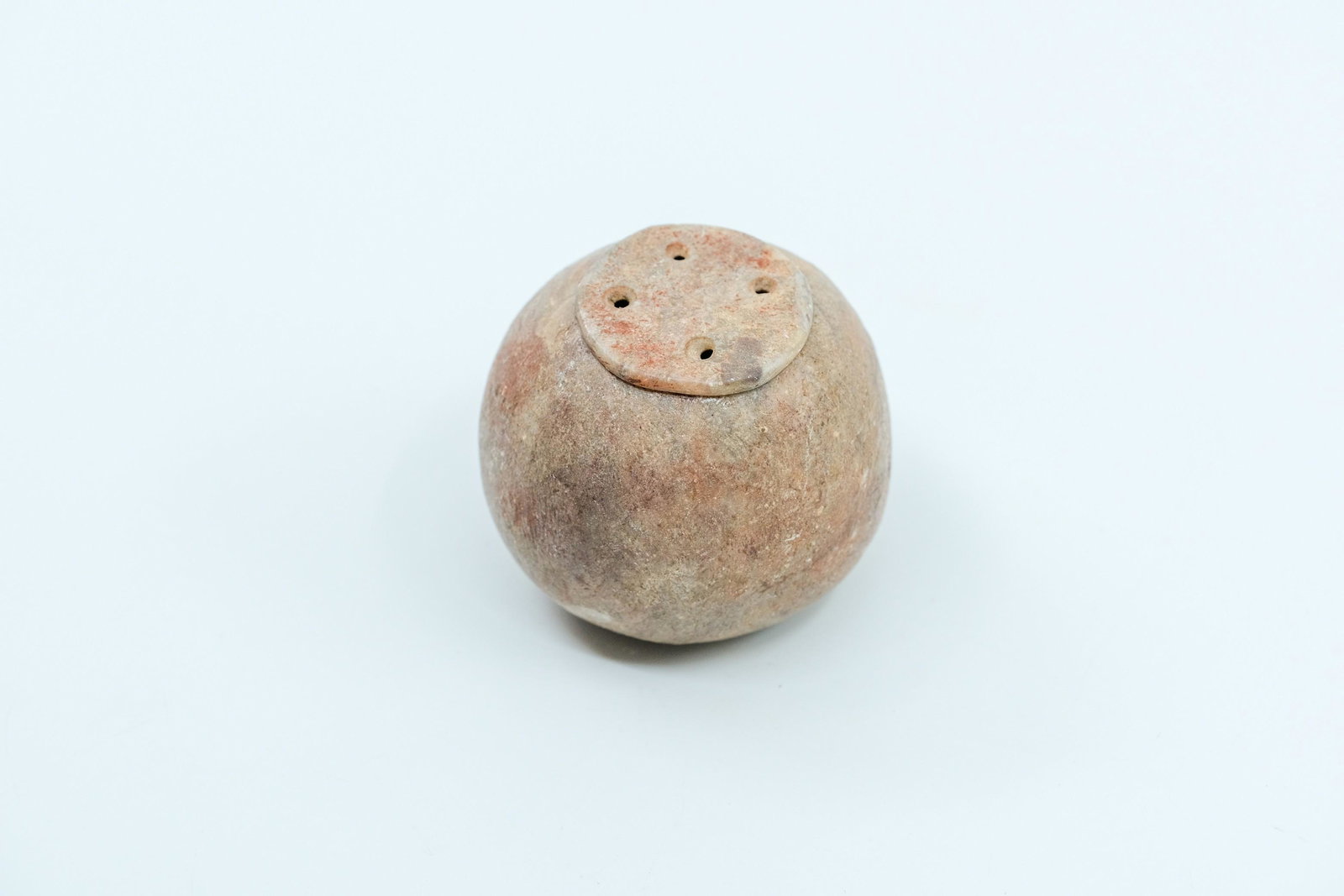 Pre-Columbian Possible Alabaster Container: Pre-Columbian Possible Alabaster Container, Small lidded container with thin flat lid, Lid has four holes, Round shape, Nice coloring. - Measurement: 1 3/4" L x 2" W Weight: 3.2 OZ.