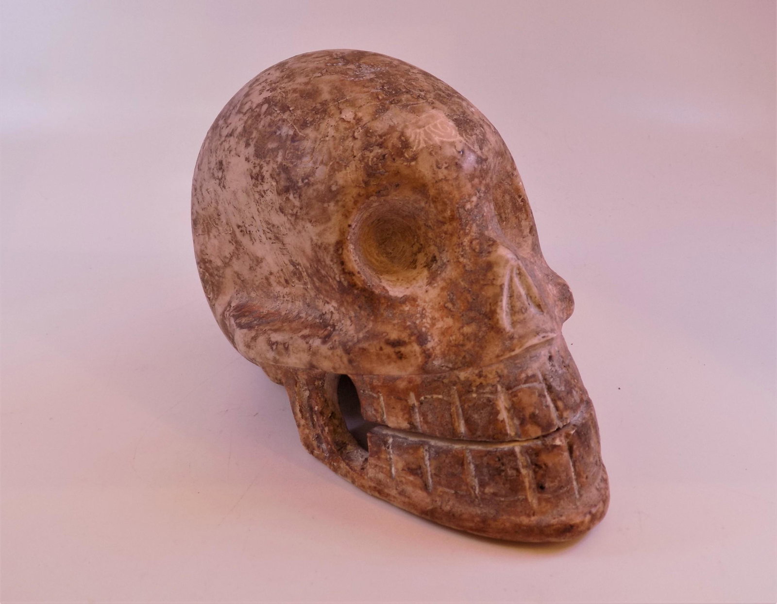 Pre-Columbian Incised Stone Skull: Pre-Columbian Stone Skull, Carved Skull, Incised rear and forefront, Origin: Guatemala. - Measurement: 7" L x 5 " W Weight: 5 LB. 2.8 OZ.