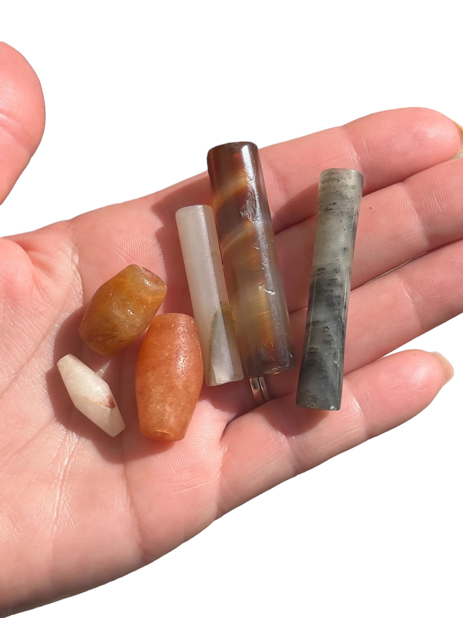 Assorted Pre-Columbian Tairona Beads, 6: Assorted Pre-Columbian Tairona Beads, 6 Included, Quartz, Carnelian, and More. Measurements:Range in size from 3/4" L to 2" L each.