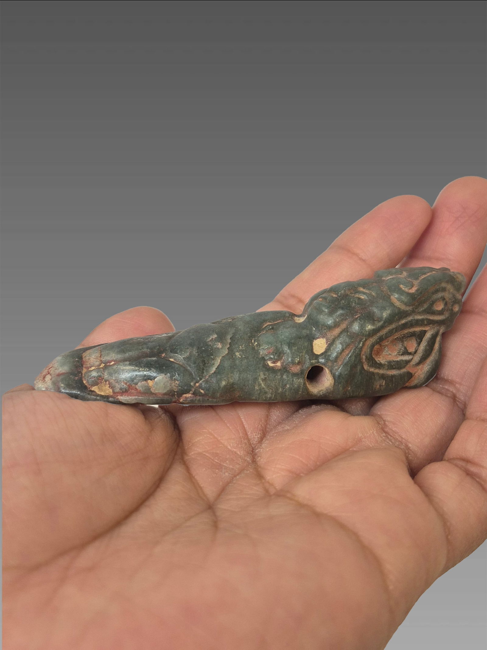 Pre-Columbian Jadiete Jade Carved Diety Mayan: Pre-Columbian Jadiete Jade Carved Diety Mayan, Stylized, Translucent, Hole For Suspension, Mesoamerica, 500-800 AD - .5"x4"