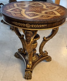 Inlaid hand carved wooden round table with egyptian queen and claw footing