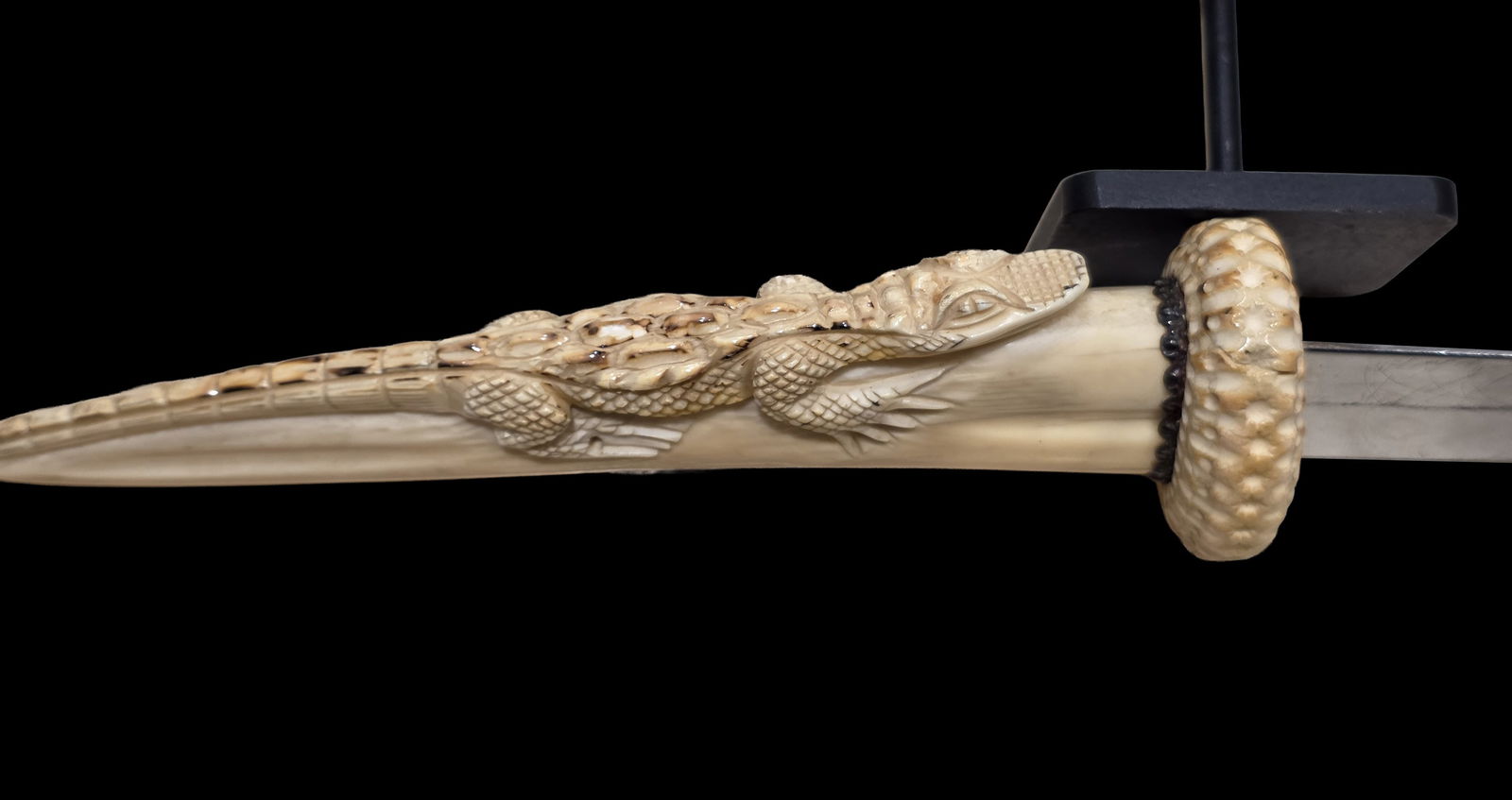 Antique 19th Century Dagger with Croccodile Carved Handle: 17.5" x 2.5" Antique 19th Century Dagger with Croccodile Carved Handle, ( Black Stand is Not Inclued , only for Photo Display Purposes )