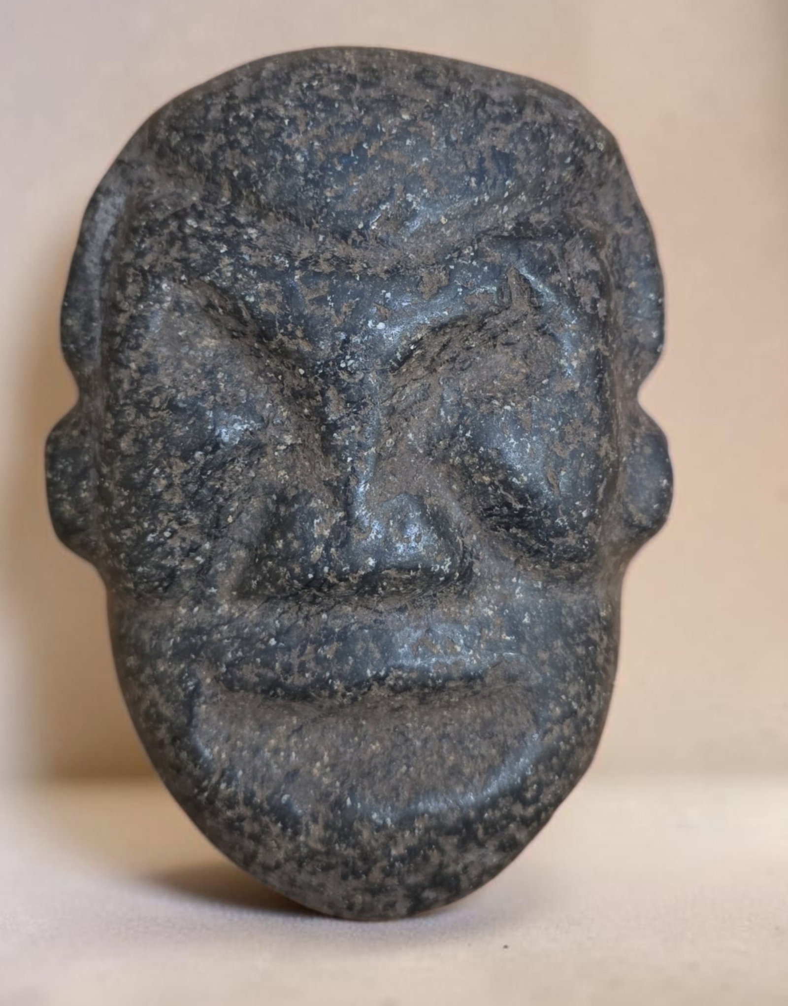Pre-Columbian Taino carved Zemi stone: 6.25" x 4.75" Pre-Columbian Taino carved Zemi stone, Stylized Brow with Deep Ridges, Grooved Eyes, Broad Nose, Wide Mouth, Charascitcs of indigenous Caribbean lithic art, Taino Culture, 800-1200 C.E.