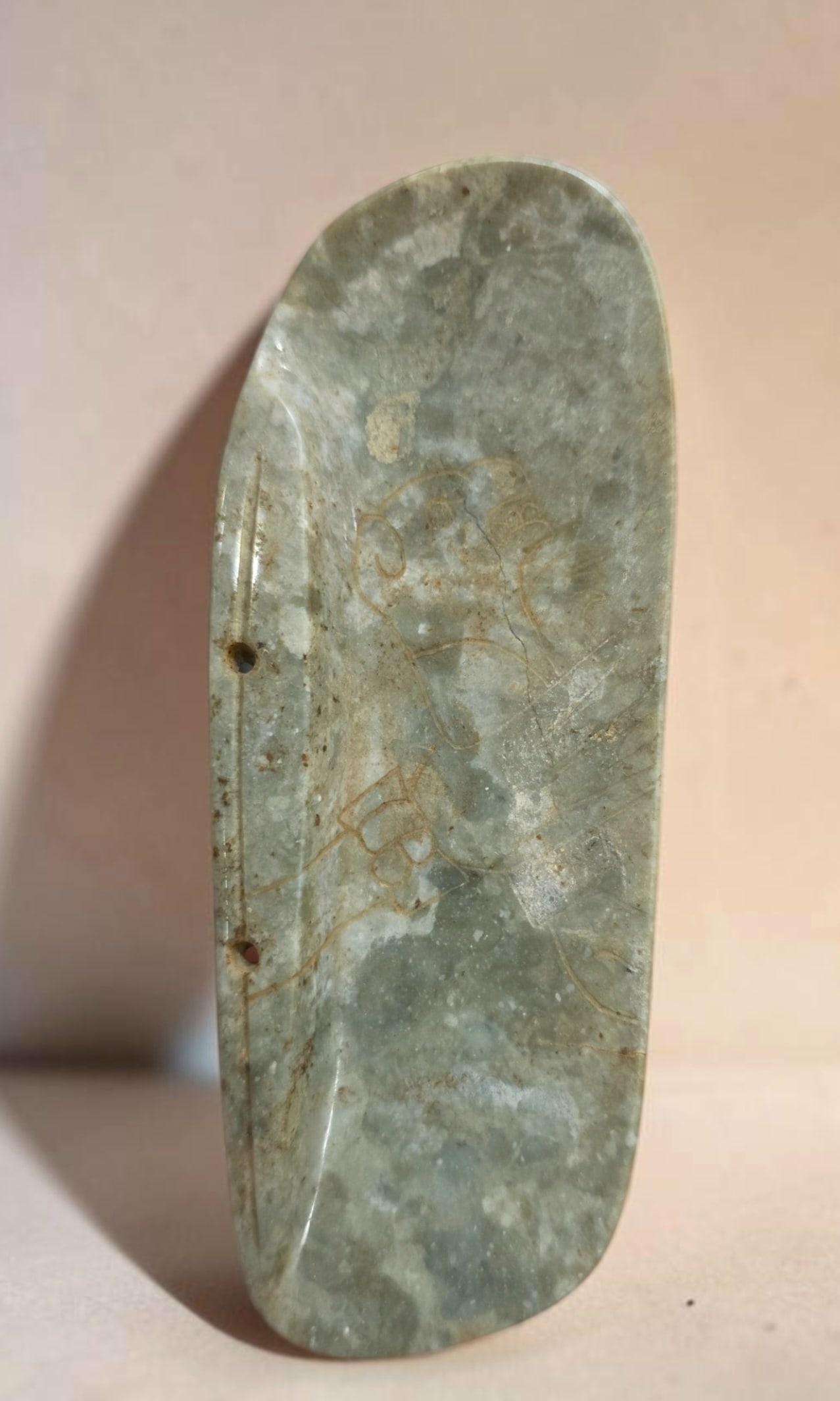 Pre-Columbian Mayan incised jade pectoral pendant: 1.75" x 5.25" Pre-Columbian Mayan incised jade pectoral pendant, Mayan Incised Lines of Jaguar, translucent jade, mineral deposits, Mesoamerica, 300-800 C.E.