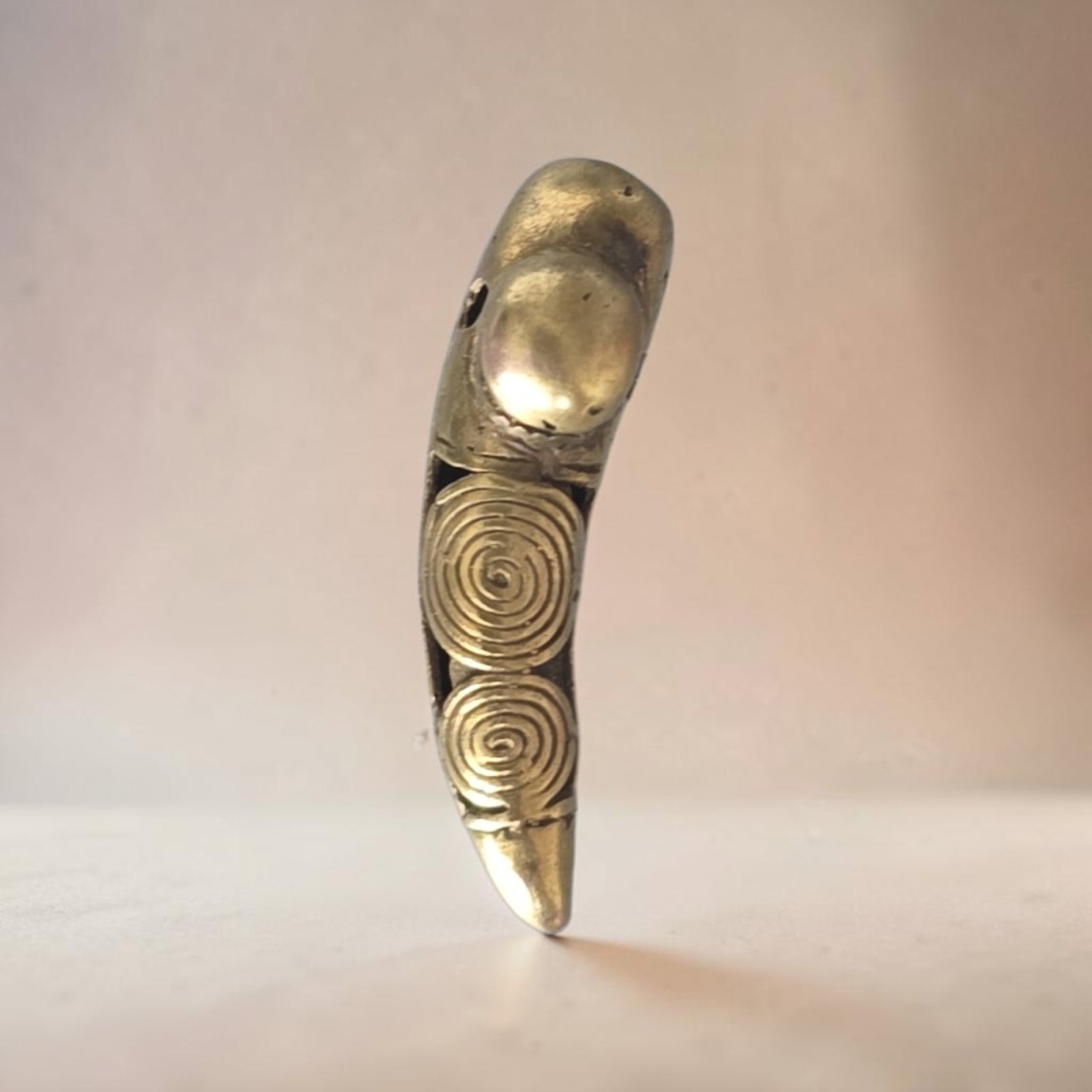 Pre-Columbian Tairona Jaguar Claw Gold Pendant Bead: 1 1/8" Pre-Columbian Tairona Jaguar Claw Gold Pendant Bead, Circular Metalwork,1.5 Grams, Tairona Culture 800-120 C.E.