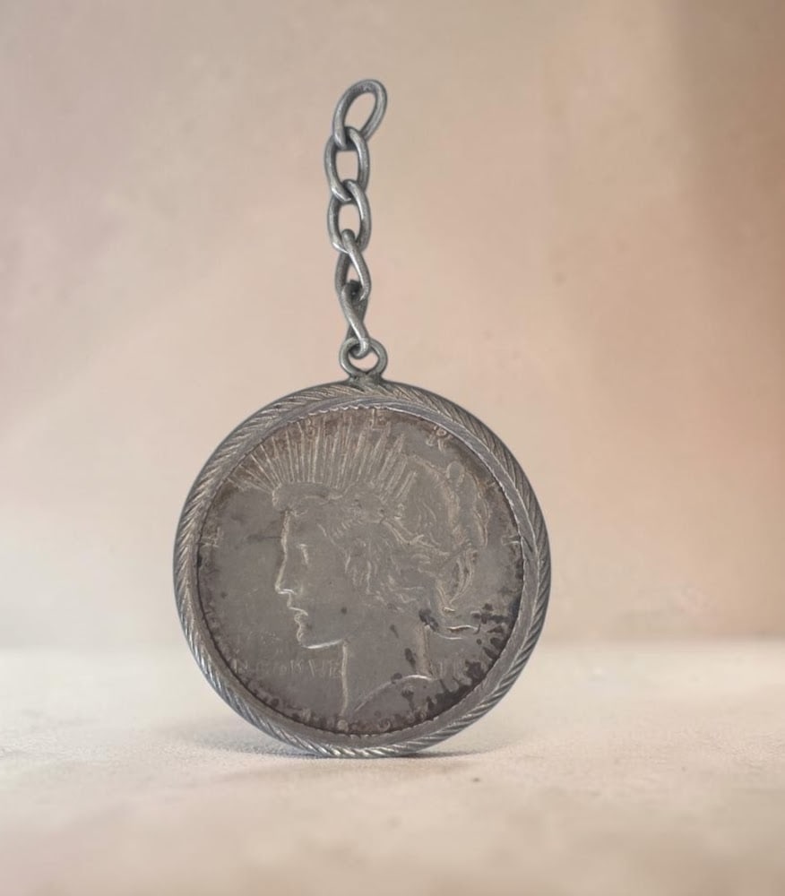 Peace Silver Dollar "Lady Liberty" in Wire Bezel: 1.5" Peace Silver Dollar "Lady Liberty" in Wire Bezel, Mounted in custom decorative twisted wire bezel