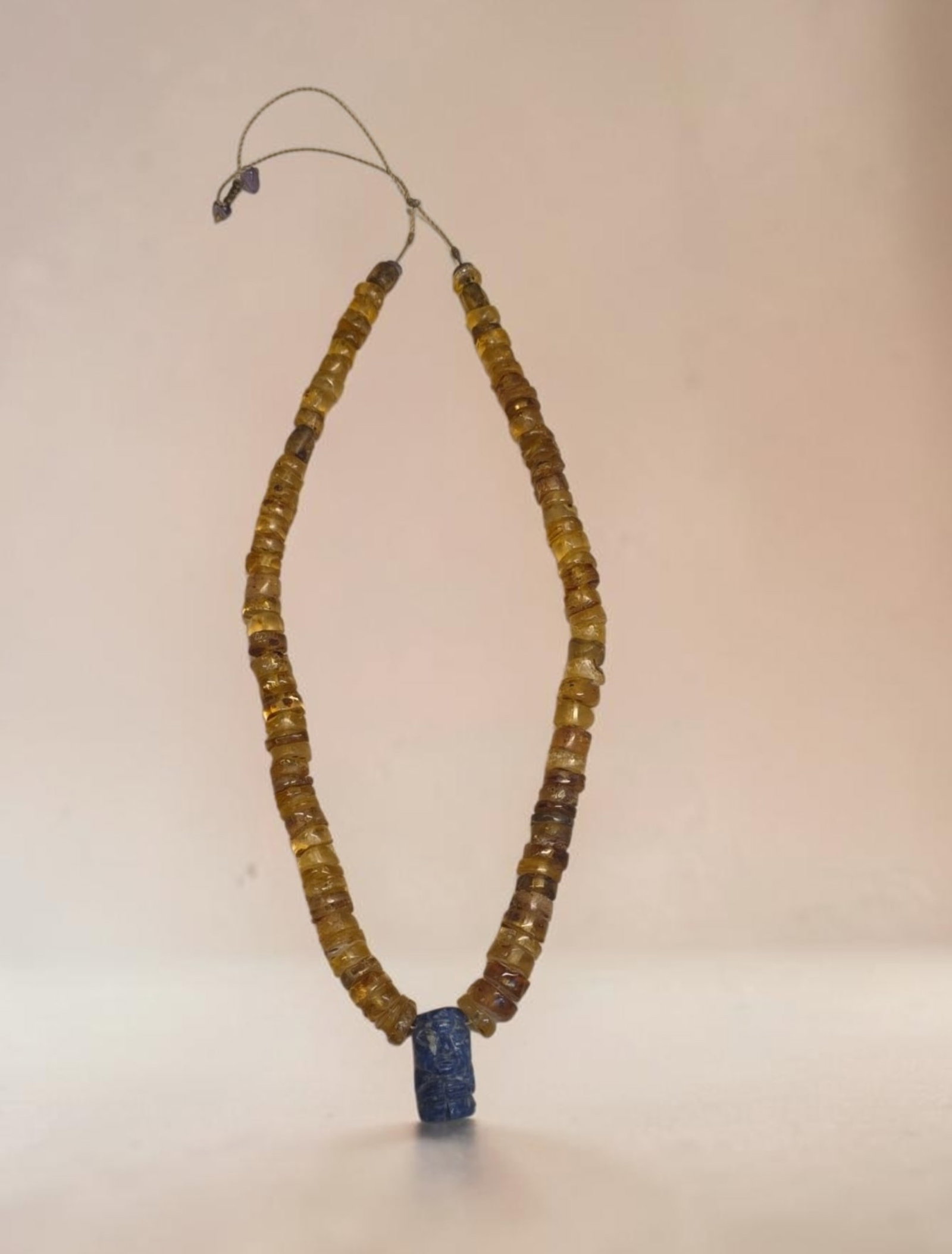 Pre-Columbian Style Amber and Sodalite Pendant Necklace: 13" Pre-Columbian Style Amber and Sodalite Pendant Necklace, Amber Disc Beads, Sodalite Effigy Center Pendant, Exact Age and Origin Unknown