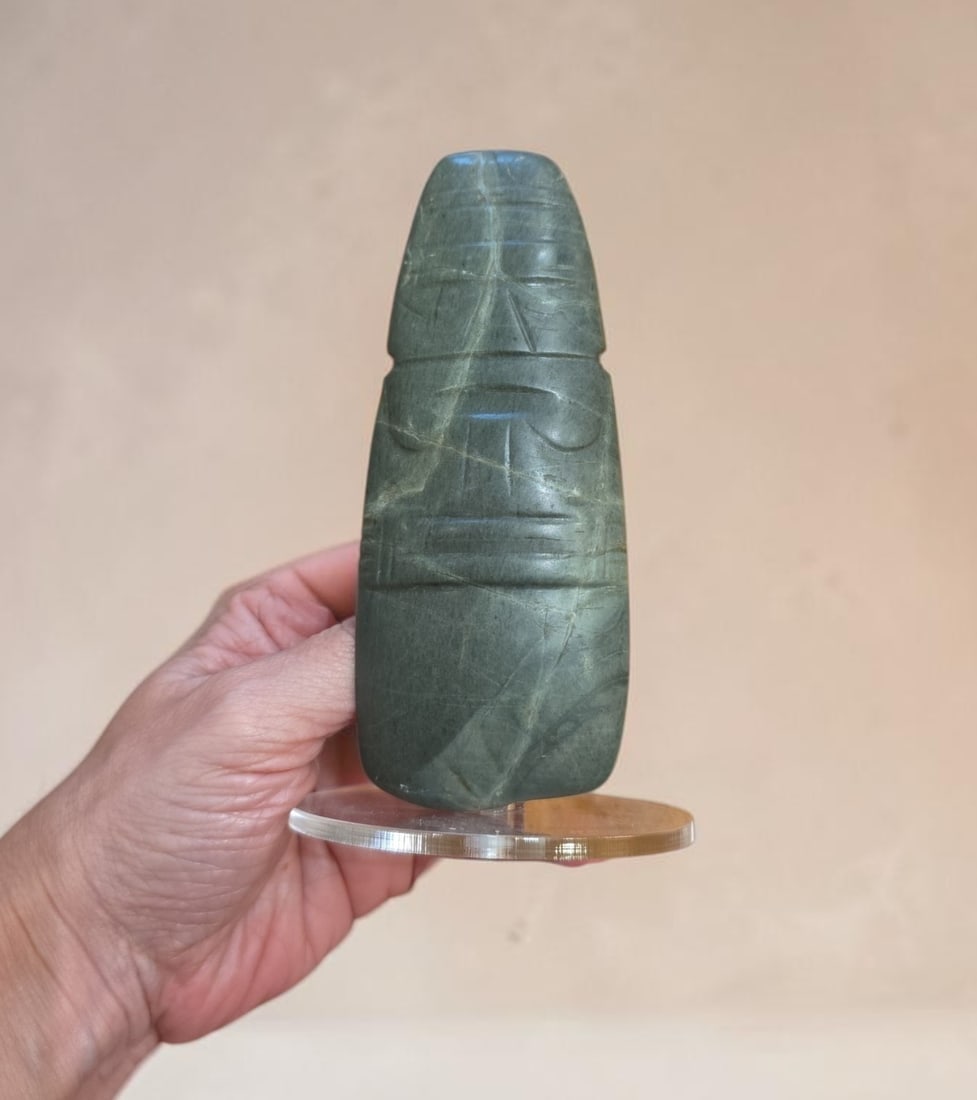 Pre-Columbian Jade Shaman Axe God Celt: 2" x 4.75" Pre-Columbian Jade Shaman Axe God Celt, Stylized Human Face, Incised Arms and hands folded over the stomach, Tapered Jade Stone blade, Nicoya Costa Rica, 500-900 C.E.