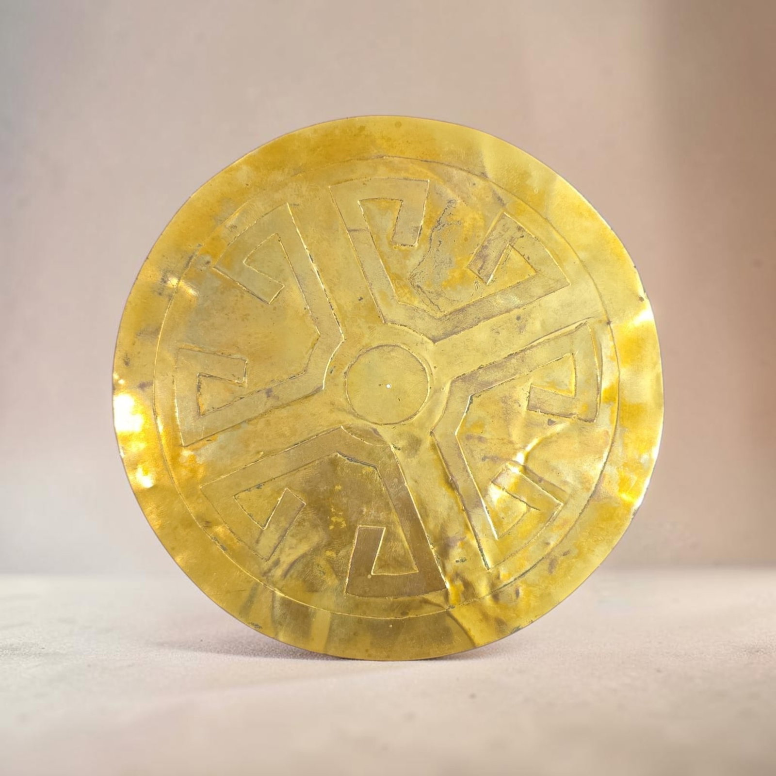 Pre-Columbian Gold Colima Pectoral: 7" Pre-Columbian Gold Colima Pectoral, Large Hammered Gold Sheet with Repousse, Stylized Geometric Patterns radiating around a central circle, Colima Culture, Colombia 200 B.C.E- 400 C.E.