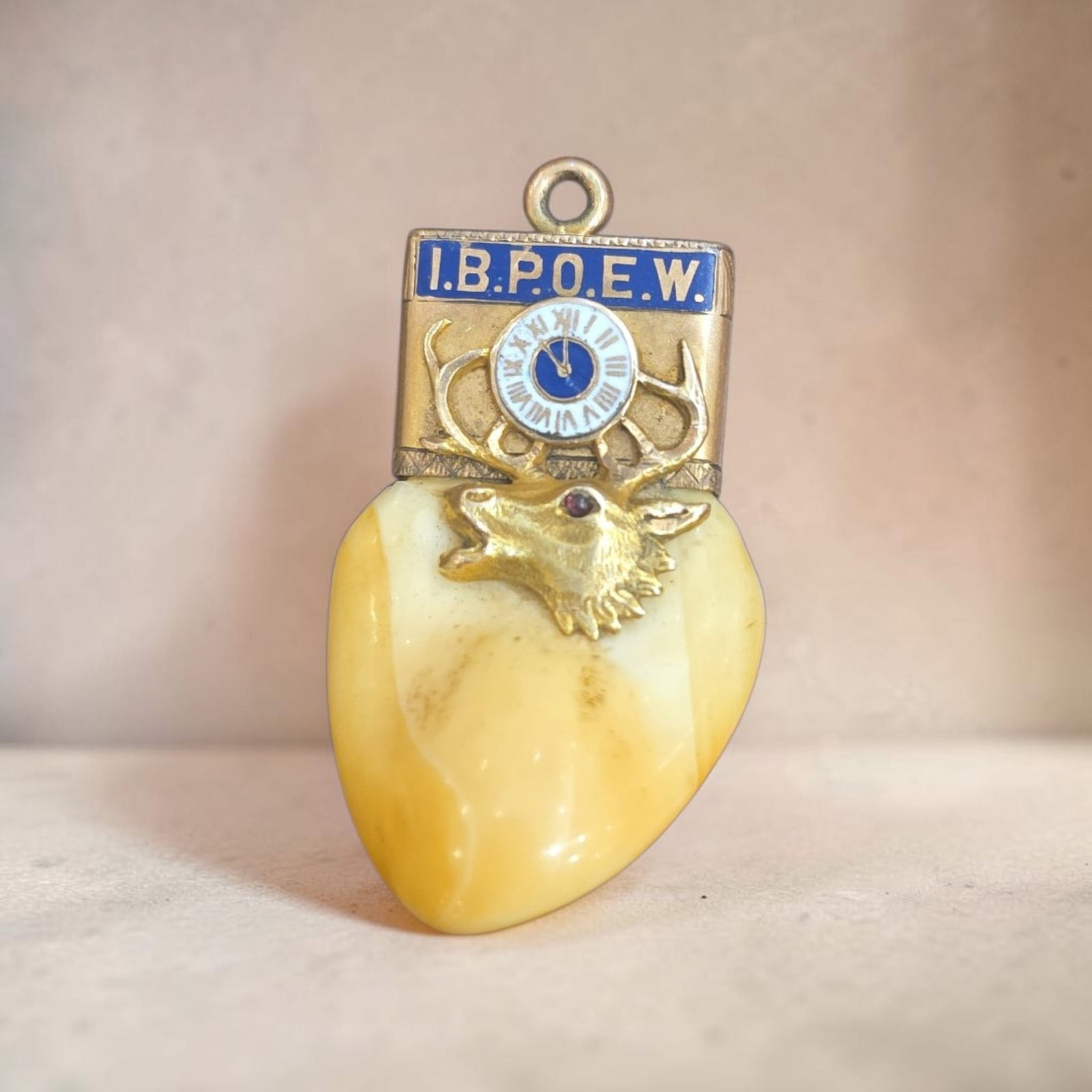 Antique B.P.O.E. Watch Fob with Elk Tooth: 1.5" x 1" Antique B.P.O.E. Watch Fob Featuring Elk Tooth, Benevolent and protective order of Elks watch fob, Carved Elk Tooth capped in yellow gold with blue enamel and traditional 11 o'clock clock