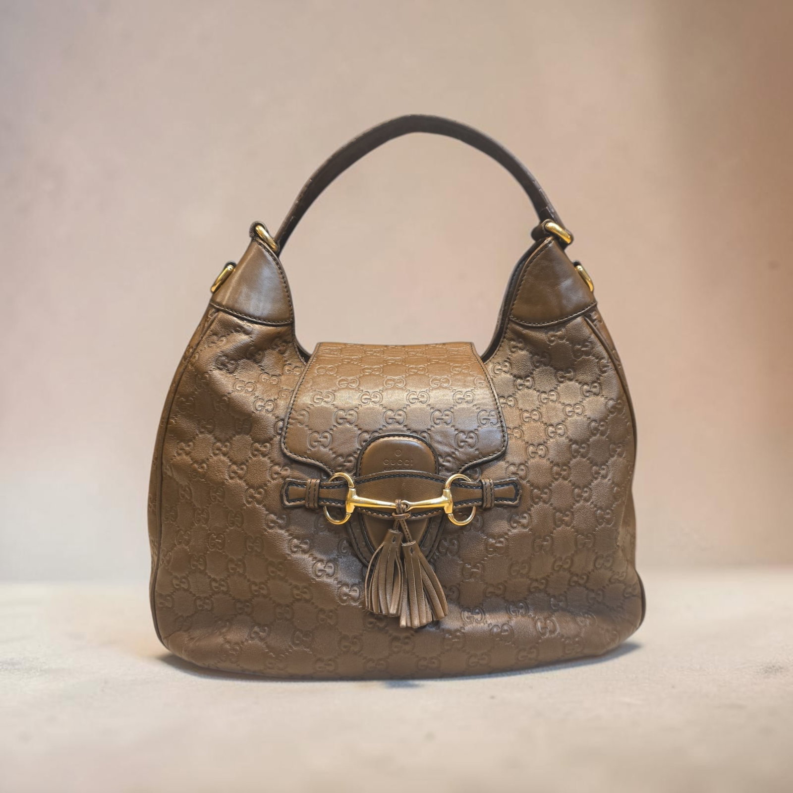 Authentic Gucci Emily Guccissima Leather Hobo Handbag: 15" x 10.5" x 5" Authentic Gucci Emily Guccissima Leather Hobo Handbag, Guccissima leather featuring the iconic interlocking GG monogram pattern, gold-tone horsebit accents across the front flap closu