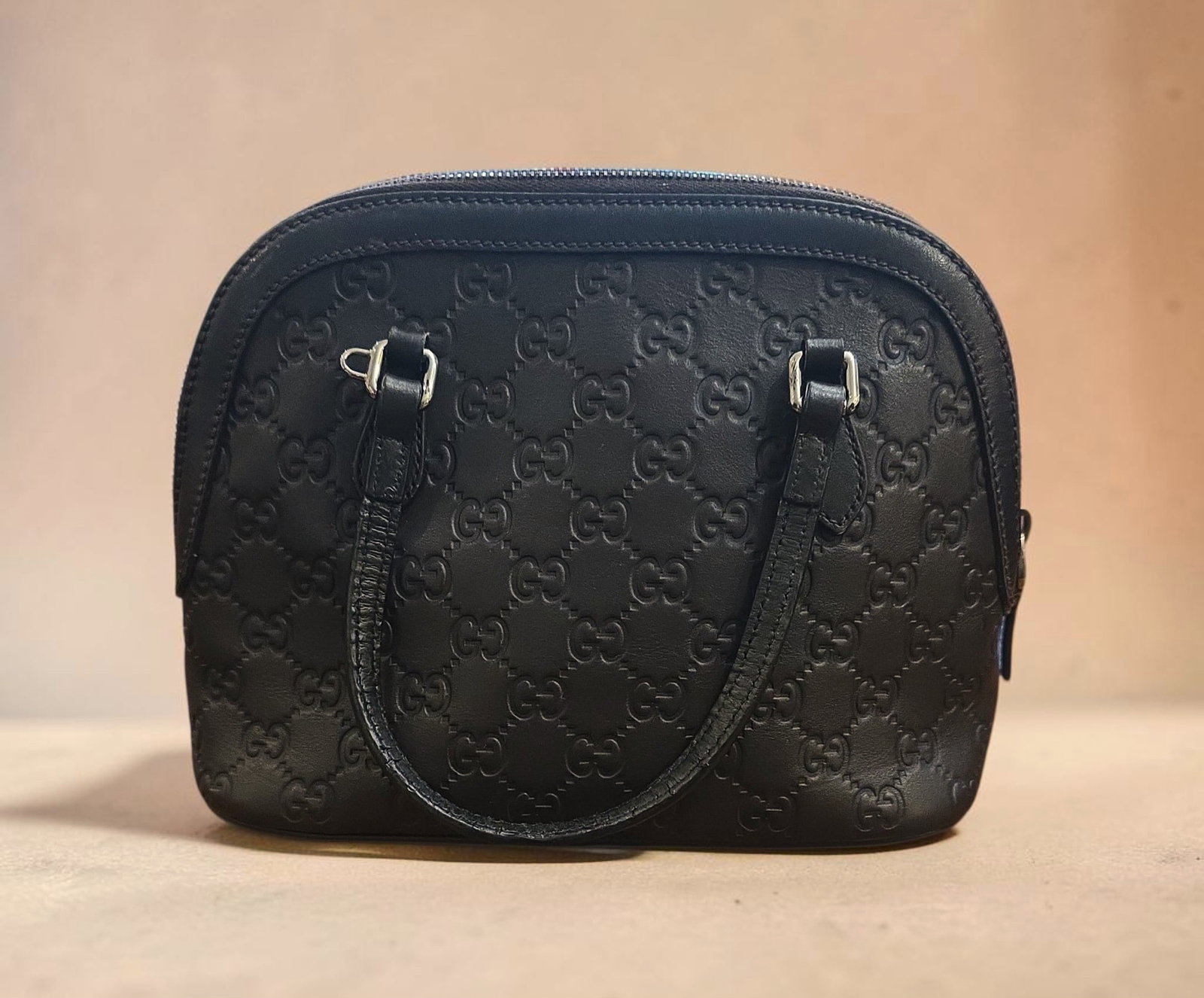 Authentic Gucci embossed leather dome satchel - brown: 9.44" x 7.88" x 4.92" Authentic Gucci embossed leather dome satchel , embossed Gucci monogram pattern, Dark Brown, Great Used Condition