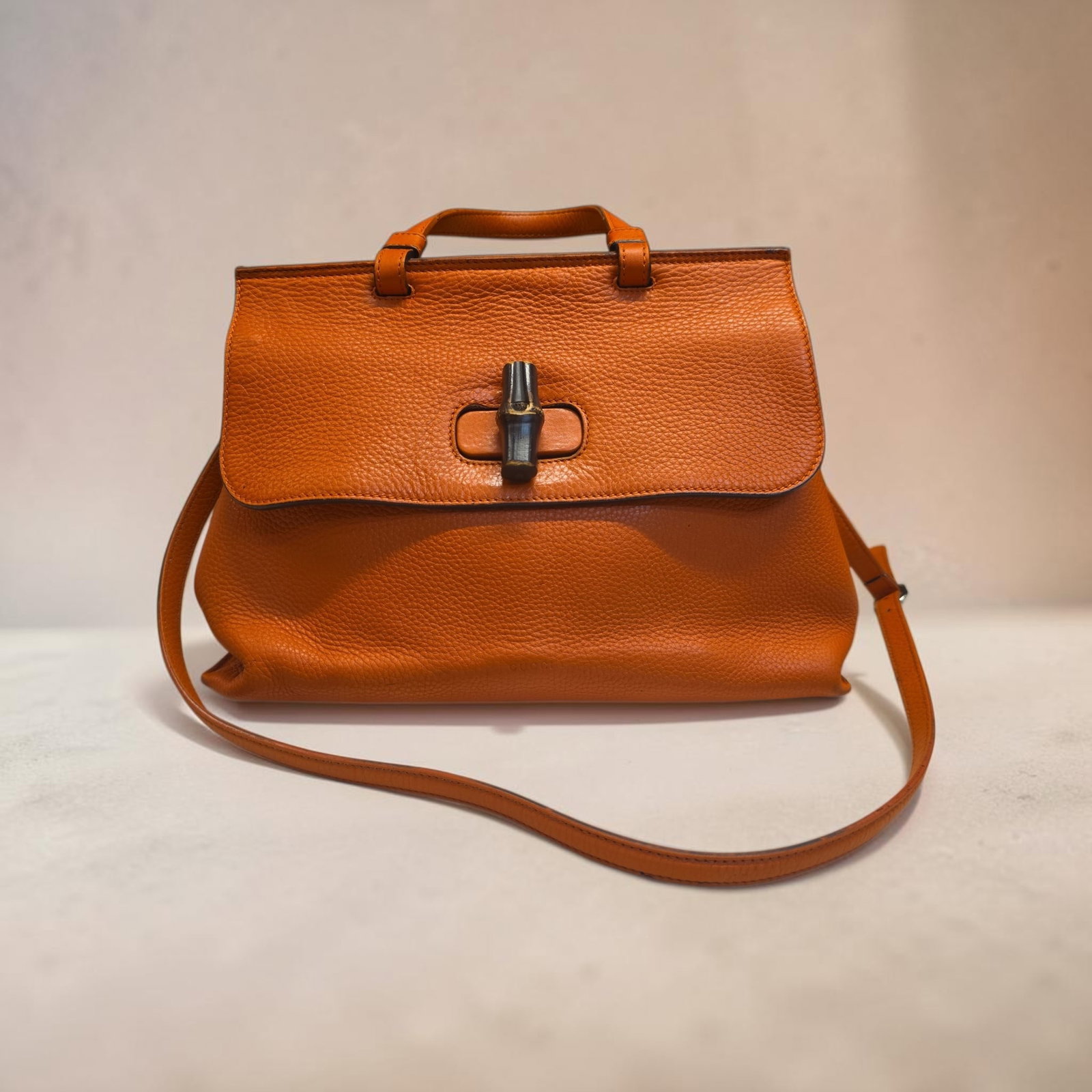 Authentic Gucci Bamboo Daily Top Handle bag, Leather: 15.75" x 6" x 11.25" Authentic Gucci Bamboo Daily Top Handle bag, Orange Leather, distinctive bamboo turn-lock closure and a convenient detachable shoulder strap, Great Used Condition