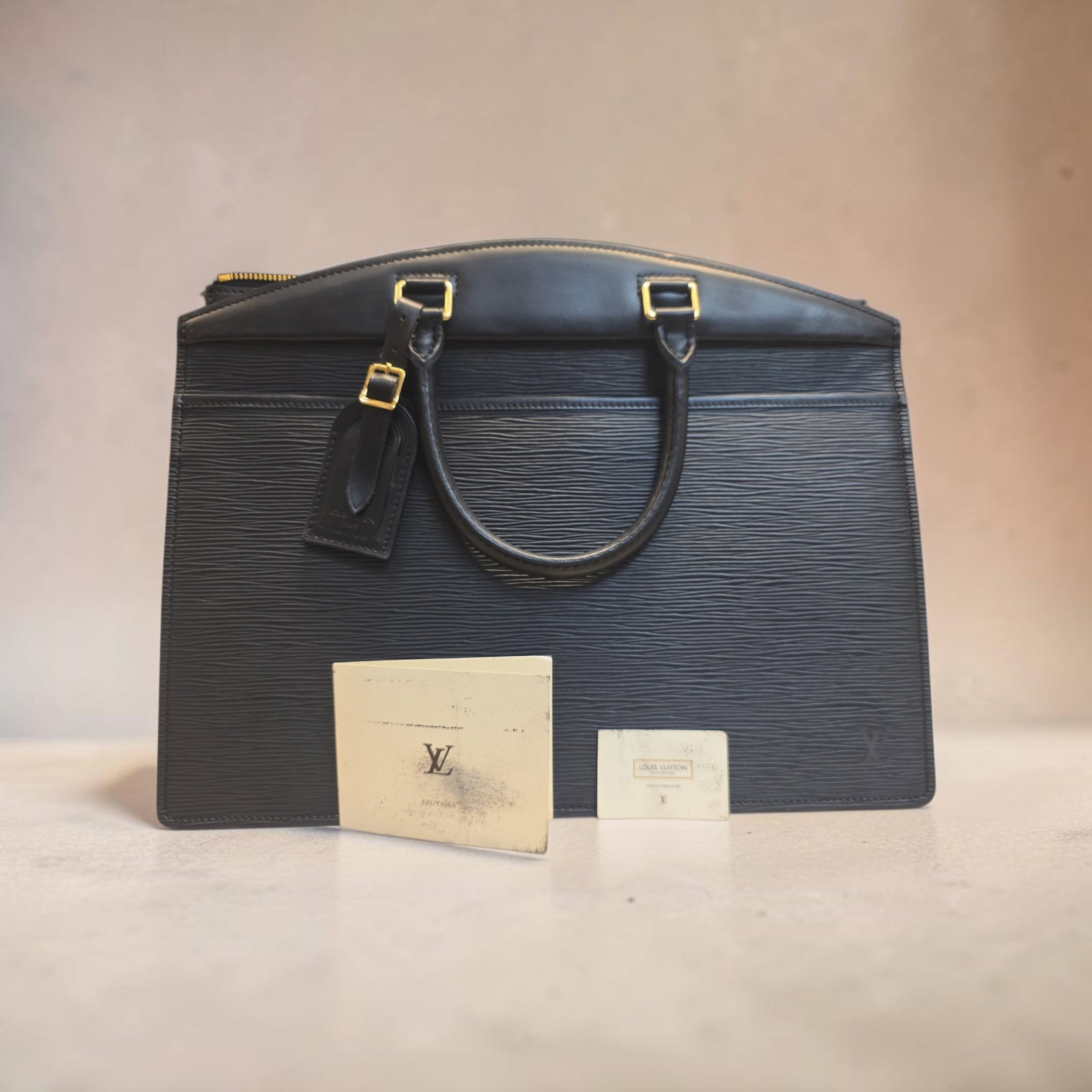 Authentic Louis Vuitton Riviera Epi Leather Tote Bag Black: 14.2" x 11" x 6.3" Authentic Louis Vuitton Riviera Epi Leather Tote Bag Black, Vintage Excellent Used Condition, Interior is "sticky" needs professional cleaning. Excellent Overall Condition, Date