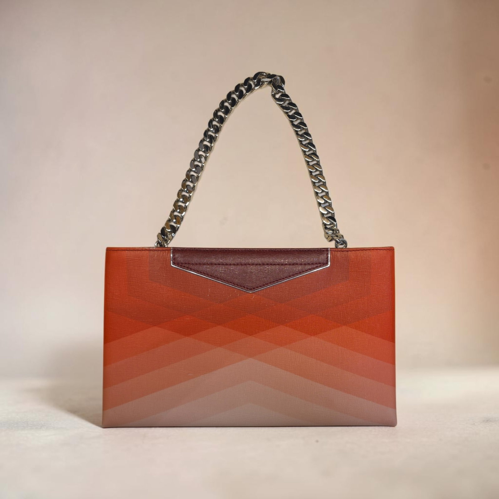 Authentic Fendi Geometric Degrade Grande Clutch Bag: 13" x 8" x 1.5" Authentic Fendi Geometric Degrade Grande Clutch Bag, Features clean, angular chevron geometric patterns layered across the front, signature angular silver-tone/palladium V-shaped