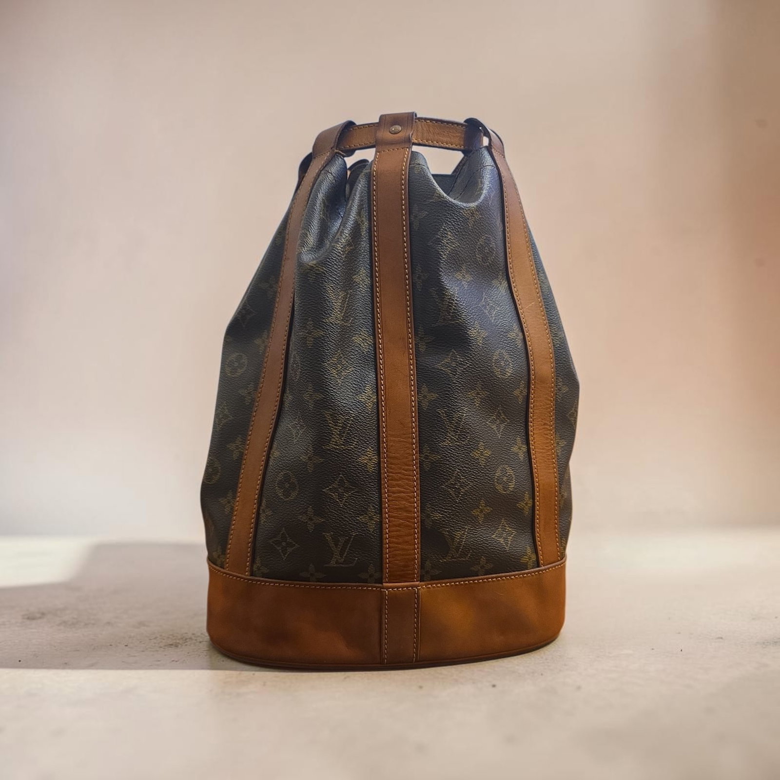 Authentic Louis Vuitton Monogram Randonn?e PM backpack: 14.6" x 11.4" x 6.3" Authentic Louis Vuitton Monogram Randonn?e PM backpack, iconic monogram coated canvas with rich vachetta leather trim and a structured base, Excellent Used Condition