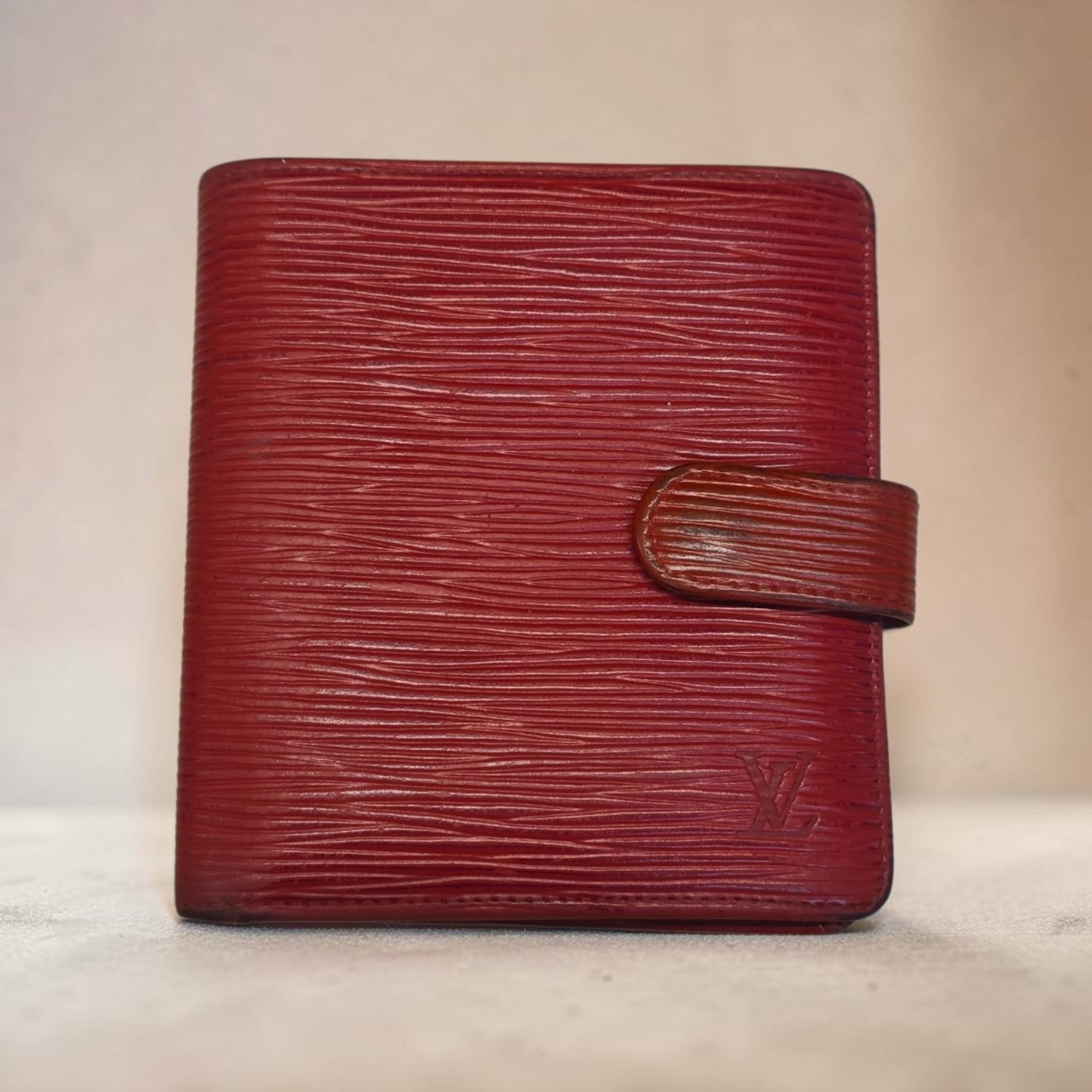 Authentic Vintage Louis Vuitton Bi-fold Epi Leather Portobier Wallet with Coin Pouch, Red Epi: 4.3" x 4.1" Authentic Vintage Louis Vuitton Bi-fold Epi Leather Portobier Wallet with Coin Pouch, Red Epi, Great Used Condition, Black lining Has peeled, Card Slots are still tight.