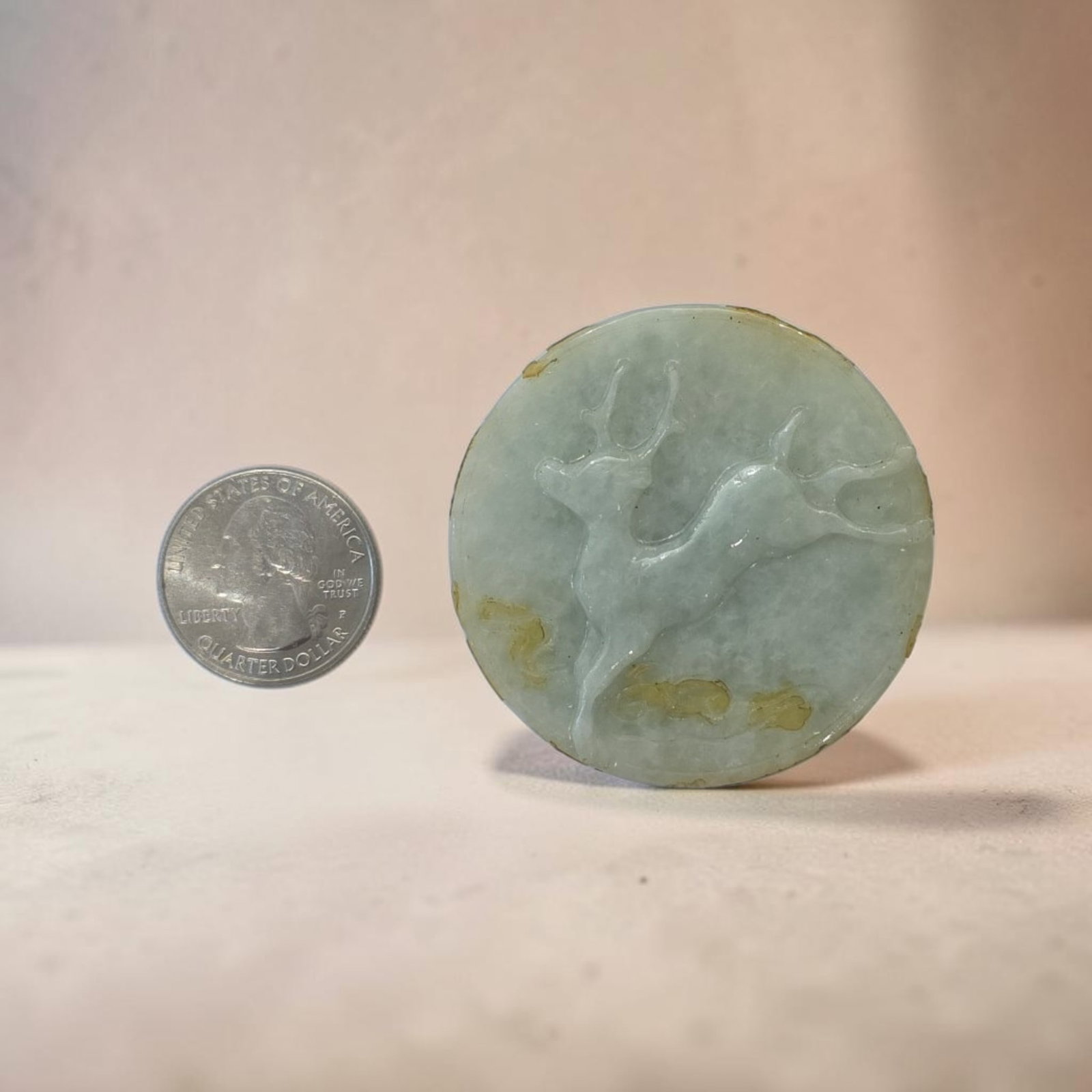 Antique Celadon Jade Smiling Laughing Buddha Disc Pendant: 2.5" Antique Celadon Jade Buddah Disc Pendant, Translucent Jade, Relief sculpture depicting a stylized deer (a traditional Chinese symbol of longevity, grace, and prosperity) in motion, Smiling Laughi