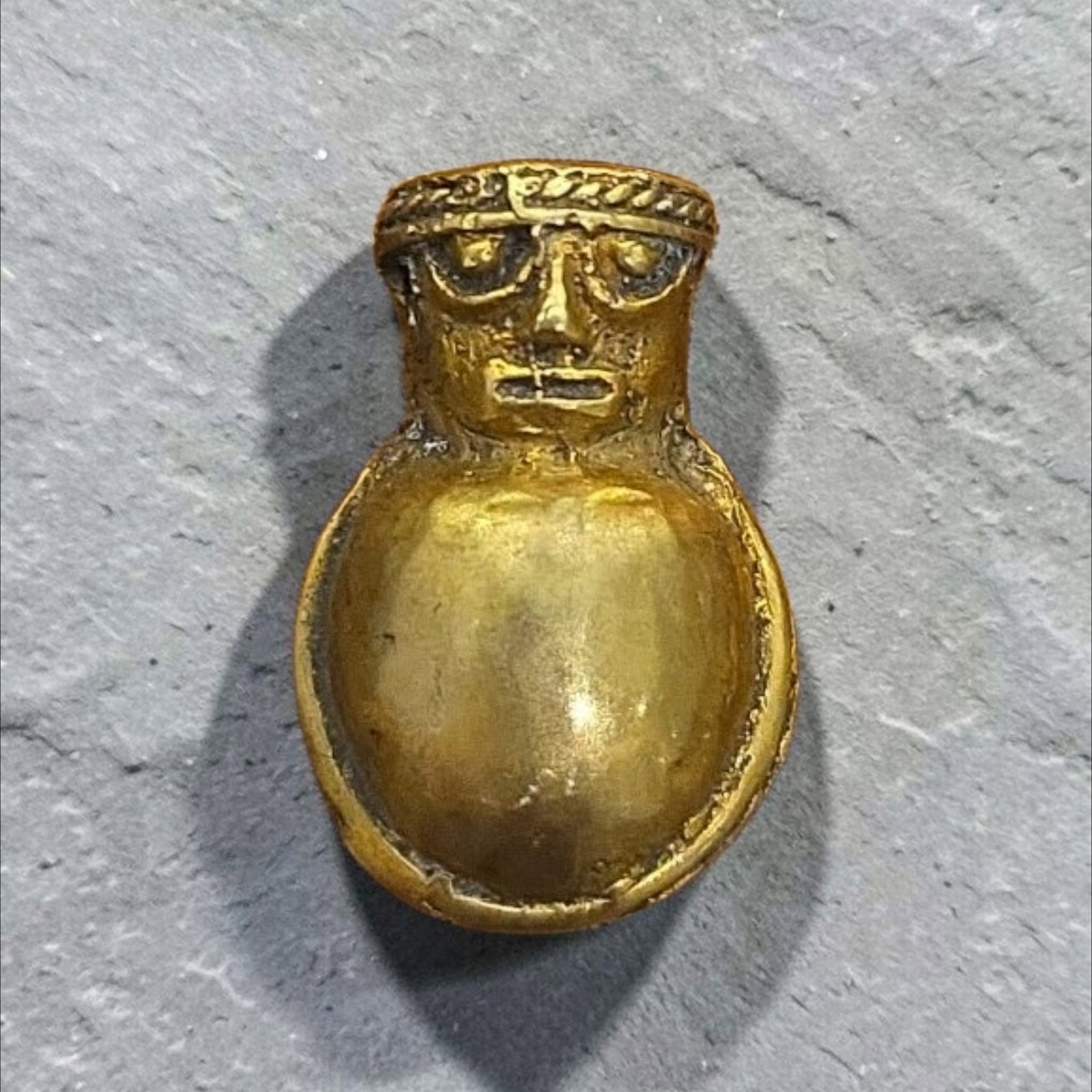Pre-Columbian Gold Figure Pendant, Tairona: .75", Pre-Columbian Gold Figure Pendant, Tairona Culture, Stylized Human Face, Ornate Headband, Rounded Body, 2.8 Grams