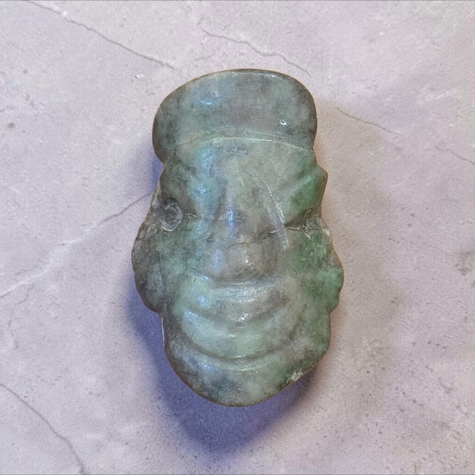 Pre-Columbian Mayan Jade Face Amulet Pendant: 1.75" x 1", Pre-Columbian Mayan Jade Face Amulet Pendant, Abstract Form Mayan Face Pendant Carving, Mineral Deposits, Translucent Jade, Mesoamerica, 300-800 C.E.